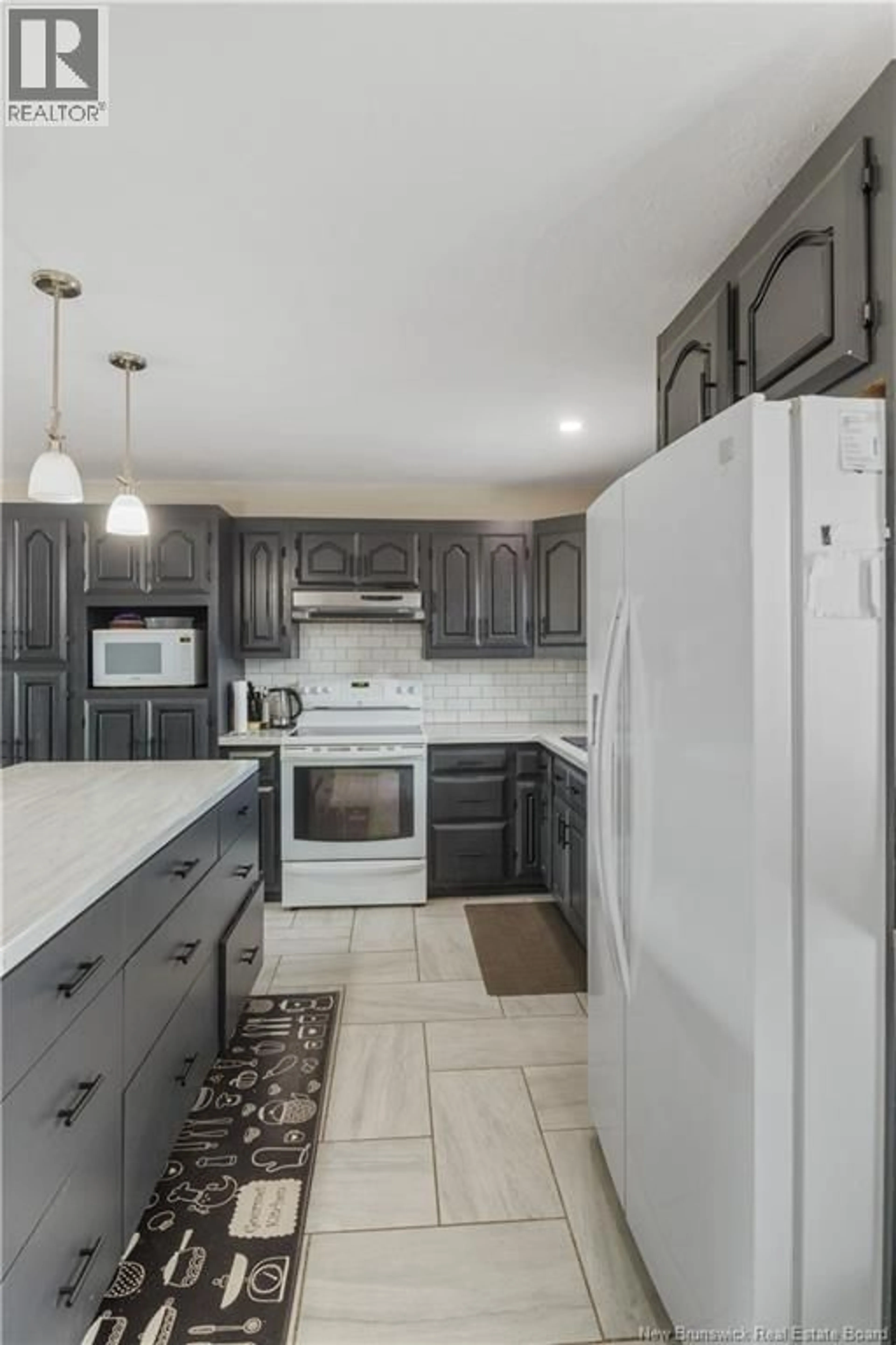 Open concept kitchen, ceramic/tile floor for 18 LOUIS-BOURG ROAD, Bouctouche New Brunswick E4S3N7