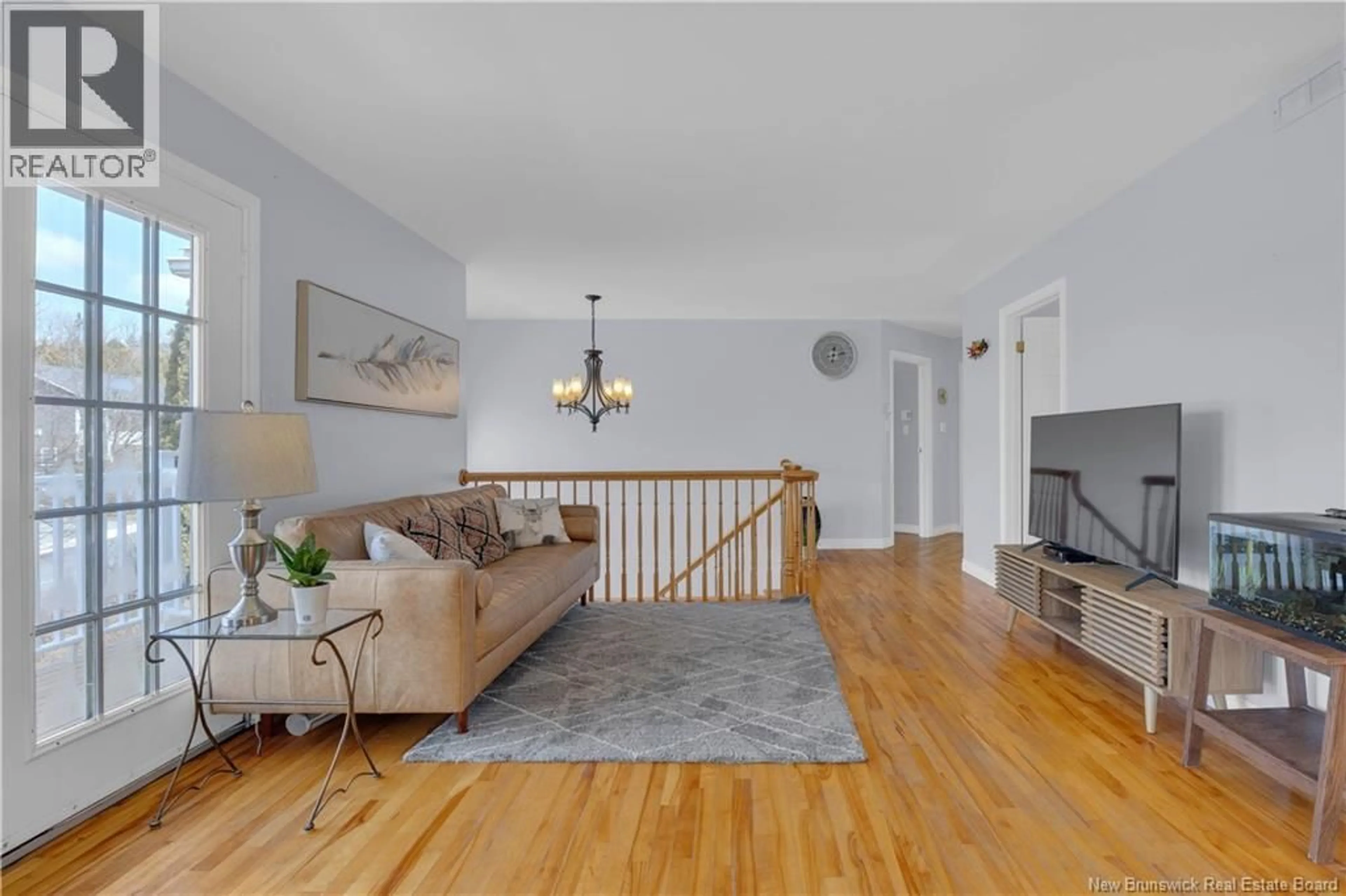 Living room with furniture, wood/laminate floor for 30 SECOUDON DRIVE, Saint John New Brunswick E2K5G5