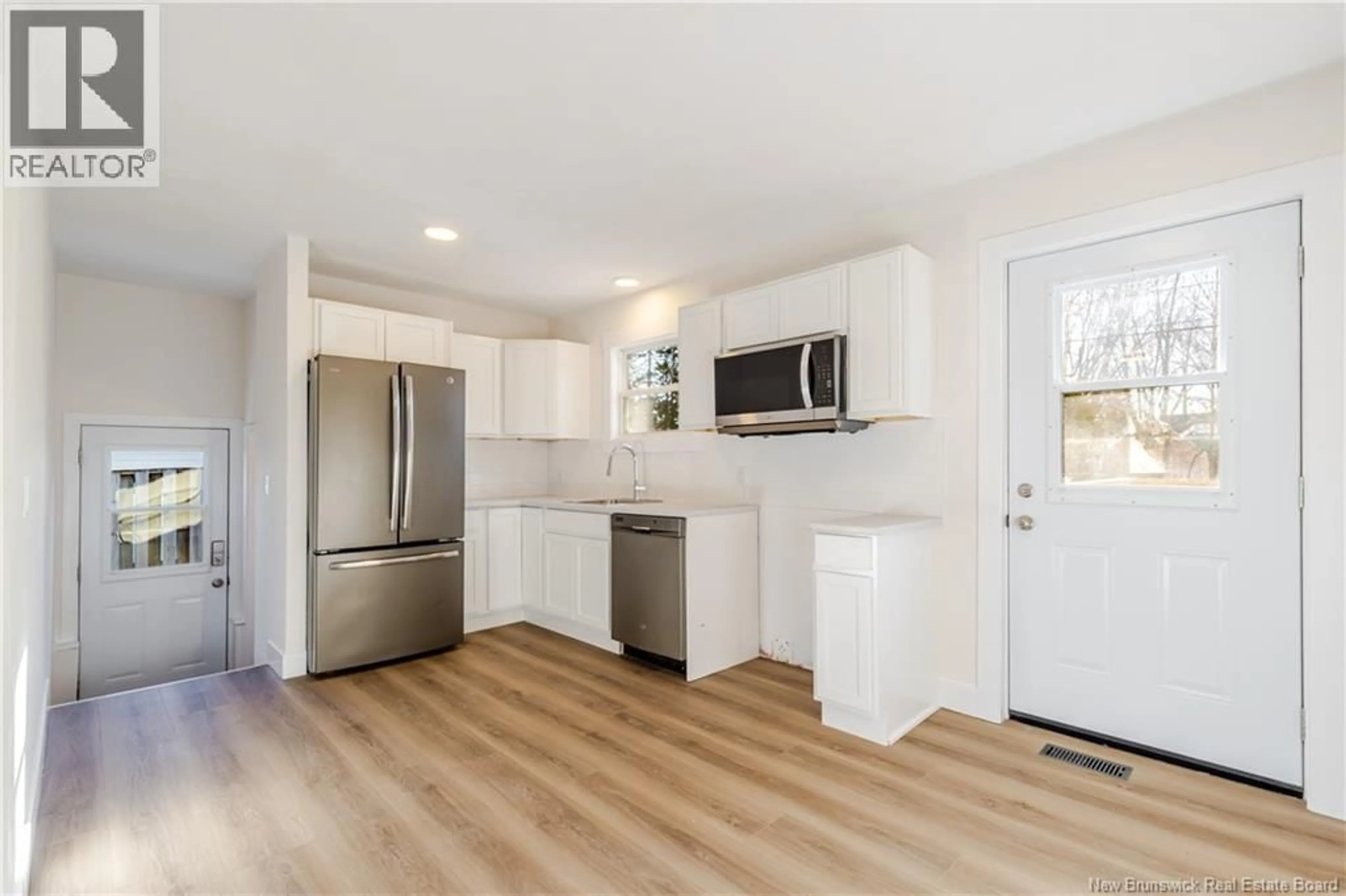 Open concept kitchen, wood/laminate floor for 108 FRASER AVENUE, Fredericton New Brunswick E3A2B1