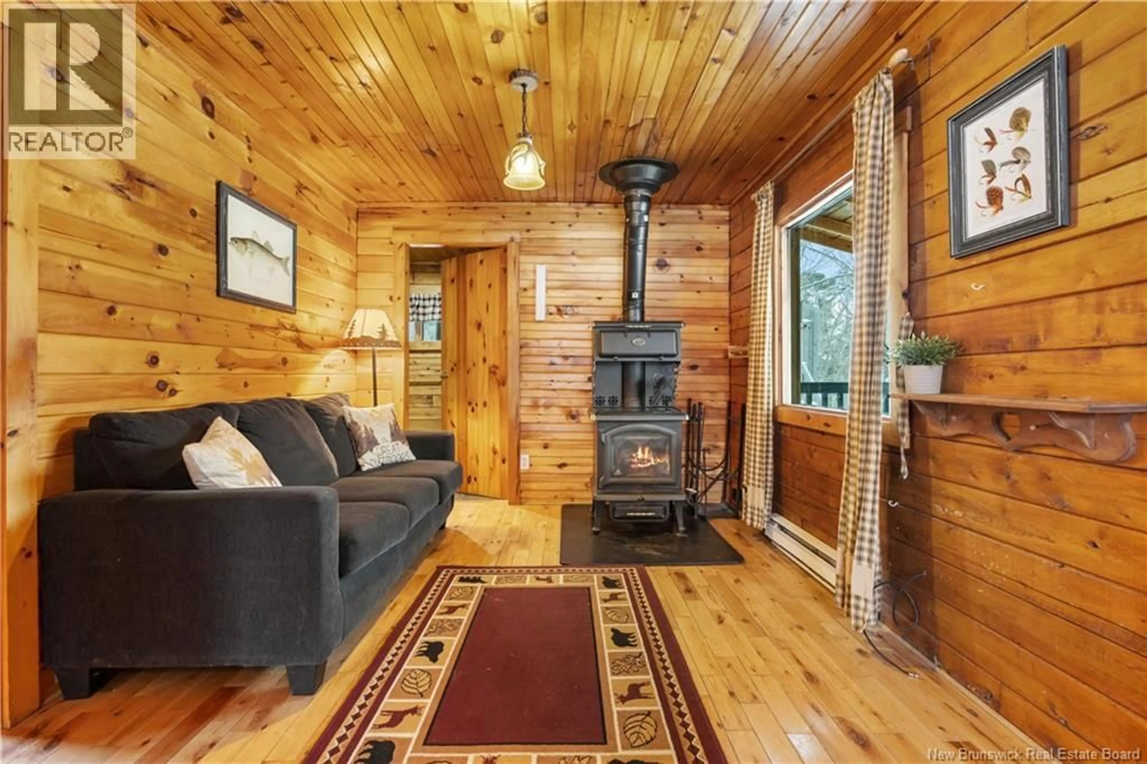 Living room with furniture, wood/laminate floor for 97 HAMBROOK POINT ROAD, Renous New Brunswick E9E2P1