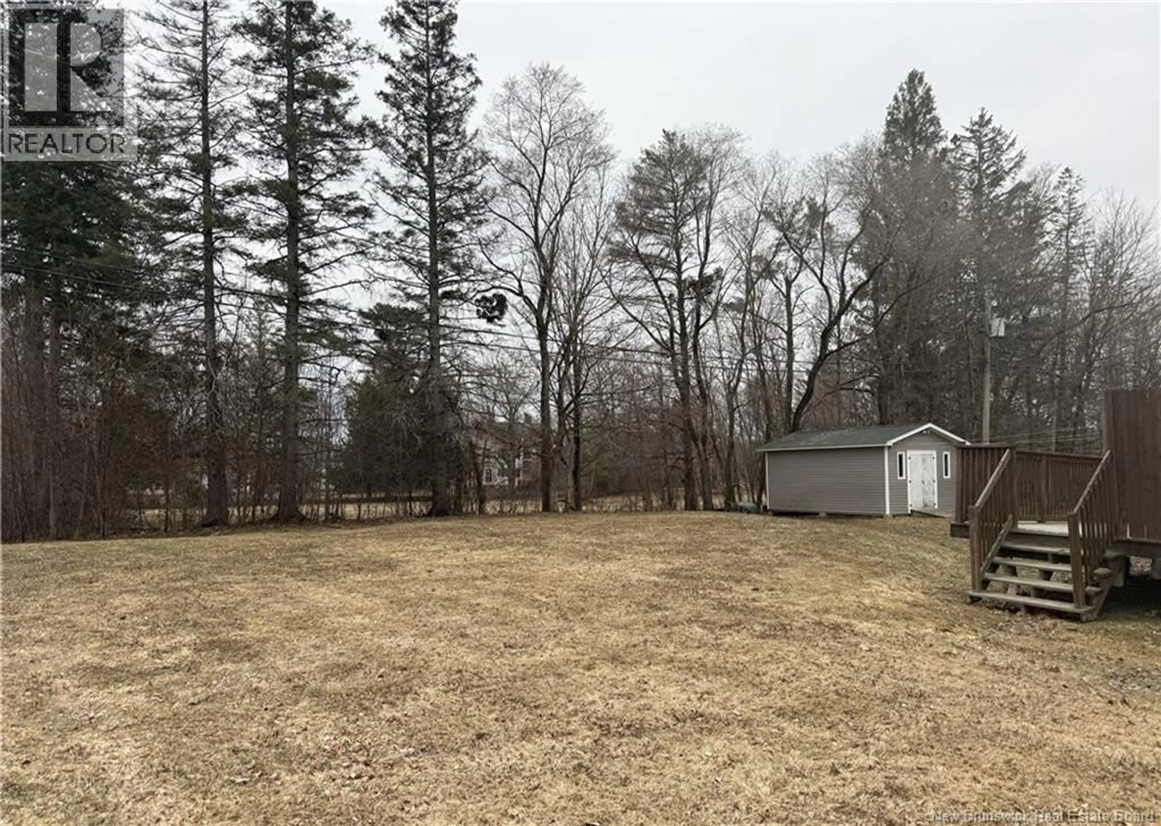 A pic from outside/outdoor area/front of a property/back of a property/a pic from drone, forest/trees view for 45-47 ELM PARK, St. Stephen New Brunswick E3L2W7