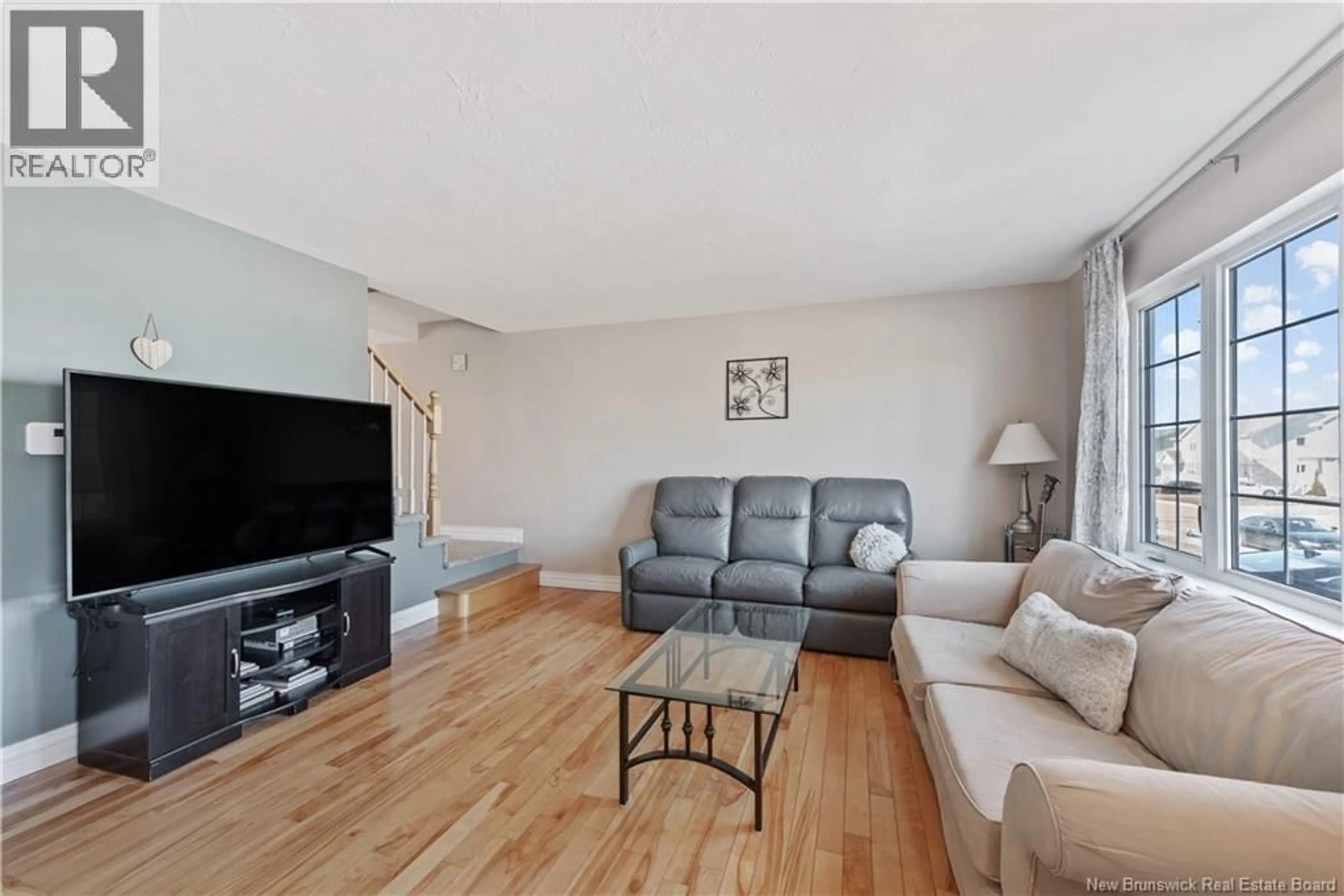 Living room with furniture, wood/laminate floor for 83 SAWGRASS DRIVE, Riverview New Brunswick E1B5E4