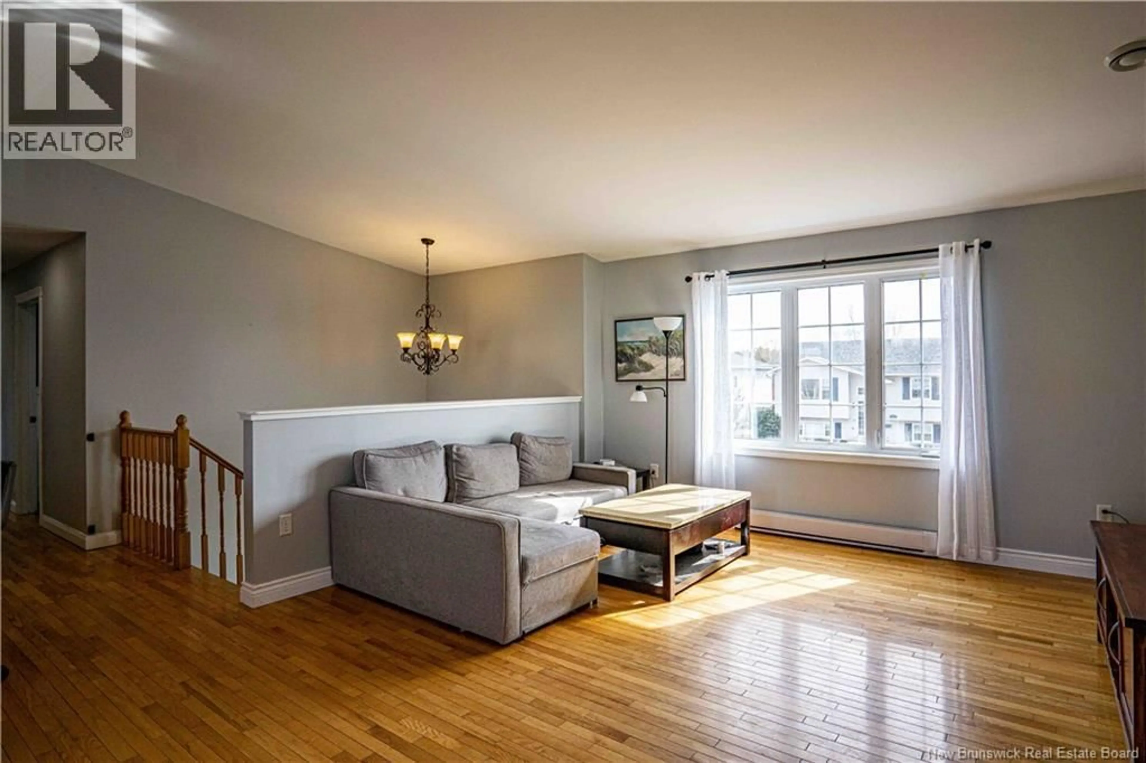 Living room with furniture, wood/laminate floor for 39 RIPLEY STREET, Oromocto New Brunswick E2V4P9