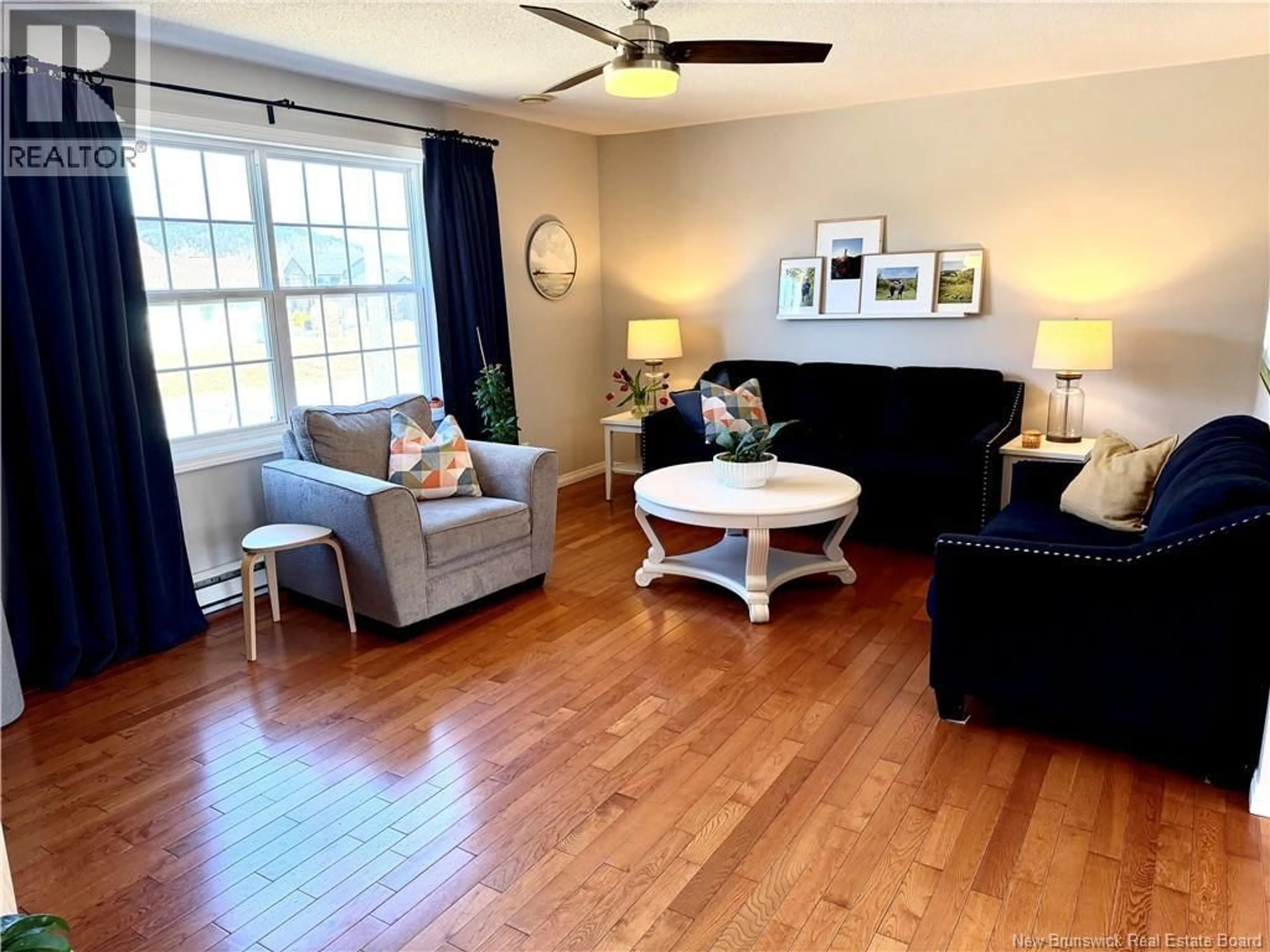 Living room with furniture, wood/laminate floor for 8 ADAM LANE, Quispamsis New Brunswick E2E6B4