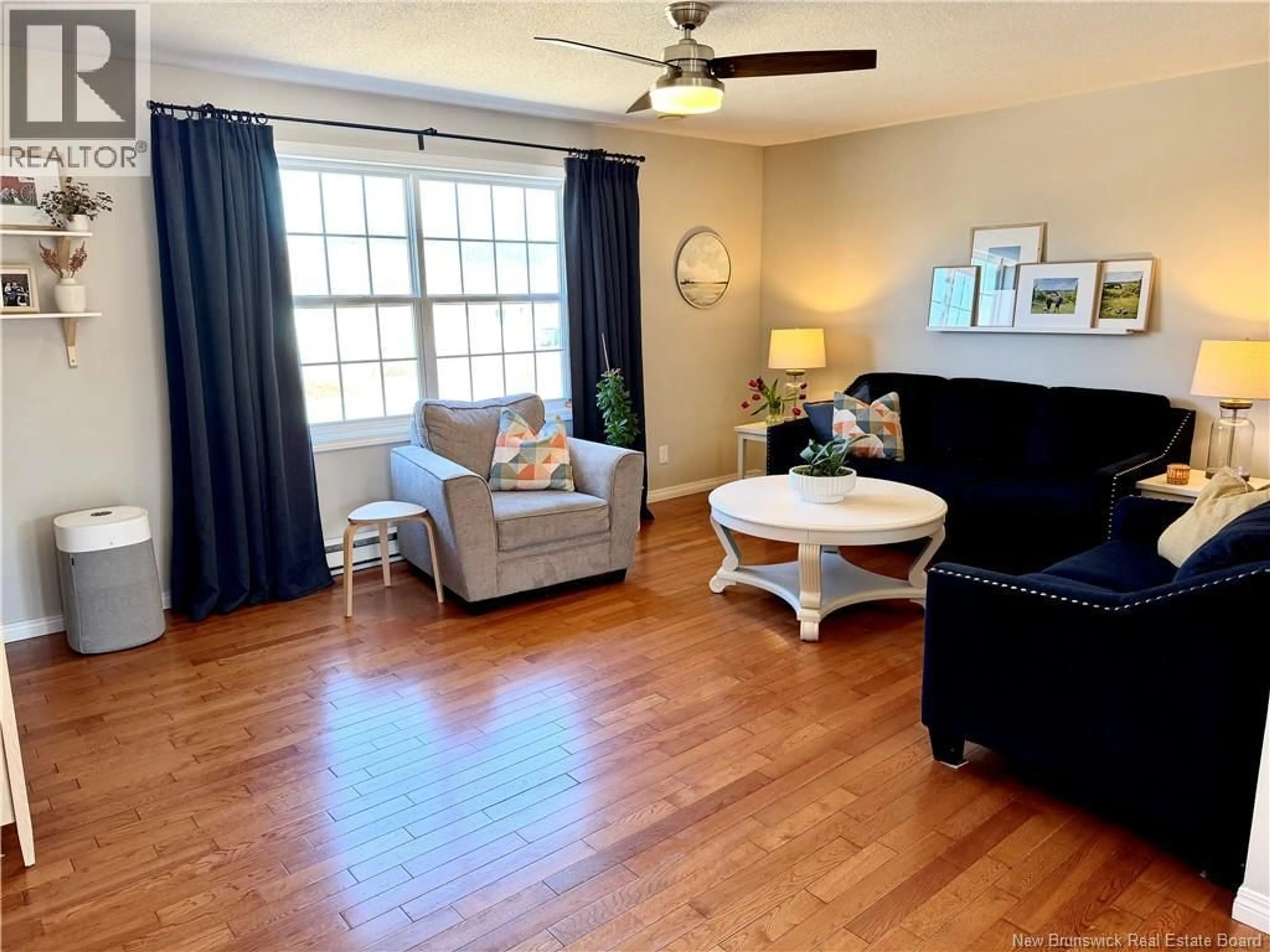 Living room with furniture, wood/laminate floor for 8 ADAM LANE, Quispamsis New Brunswick E2E6B4