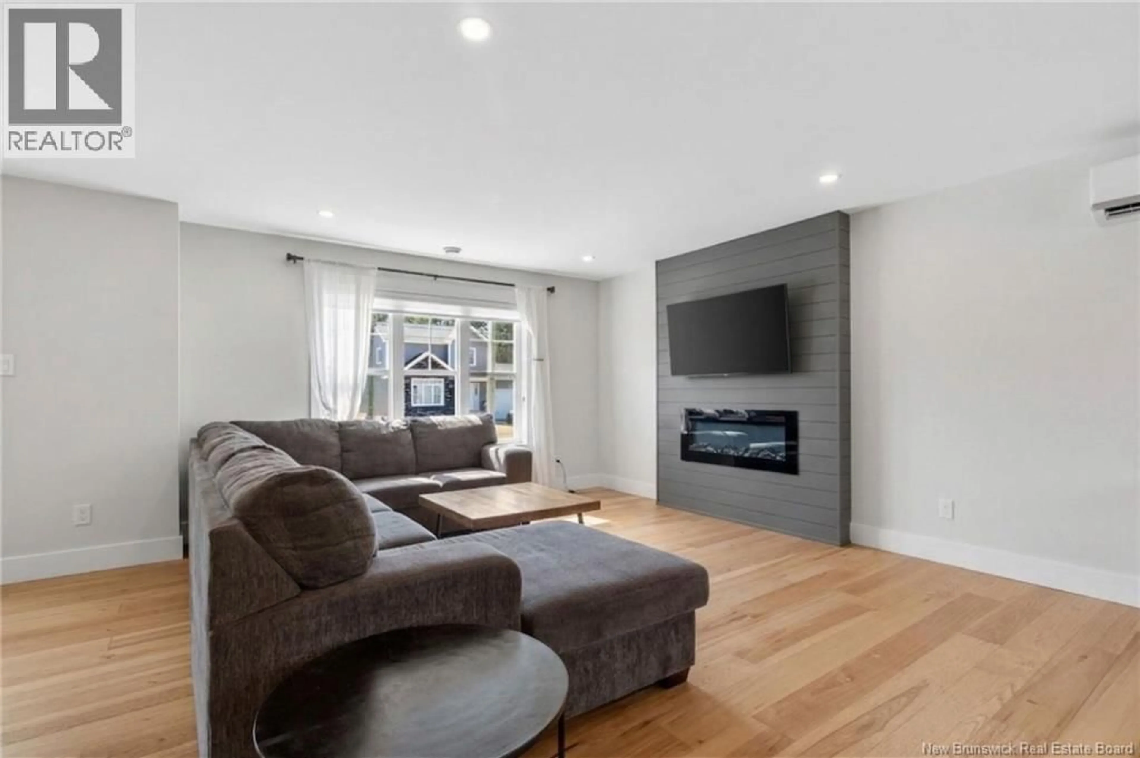 Living room with furniture, unknown for 148 DES ELEVES, Moncton New Brunswick E1A4V6