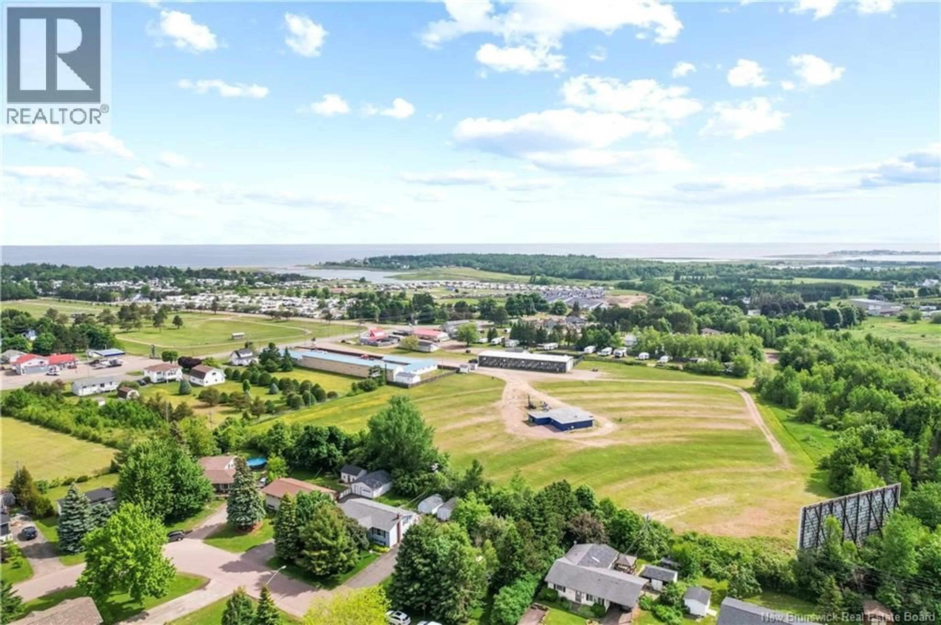 A pic from outside/outdoor area/front of a property/back of a property/a pic from drone, water/lake/river/ocean view for 90 CARTIER, Shediac New Brunswick E4P1L3