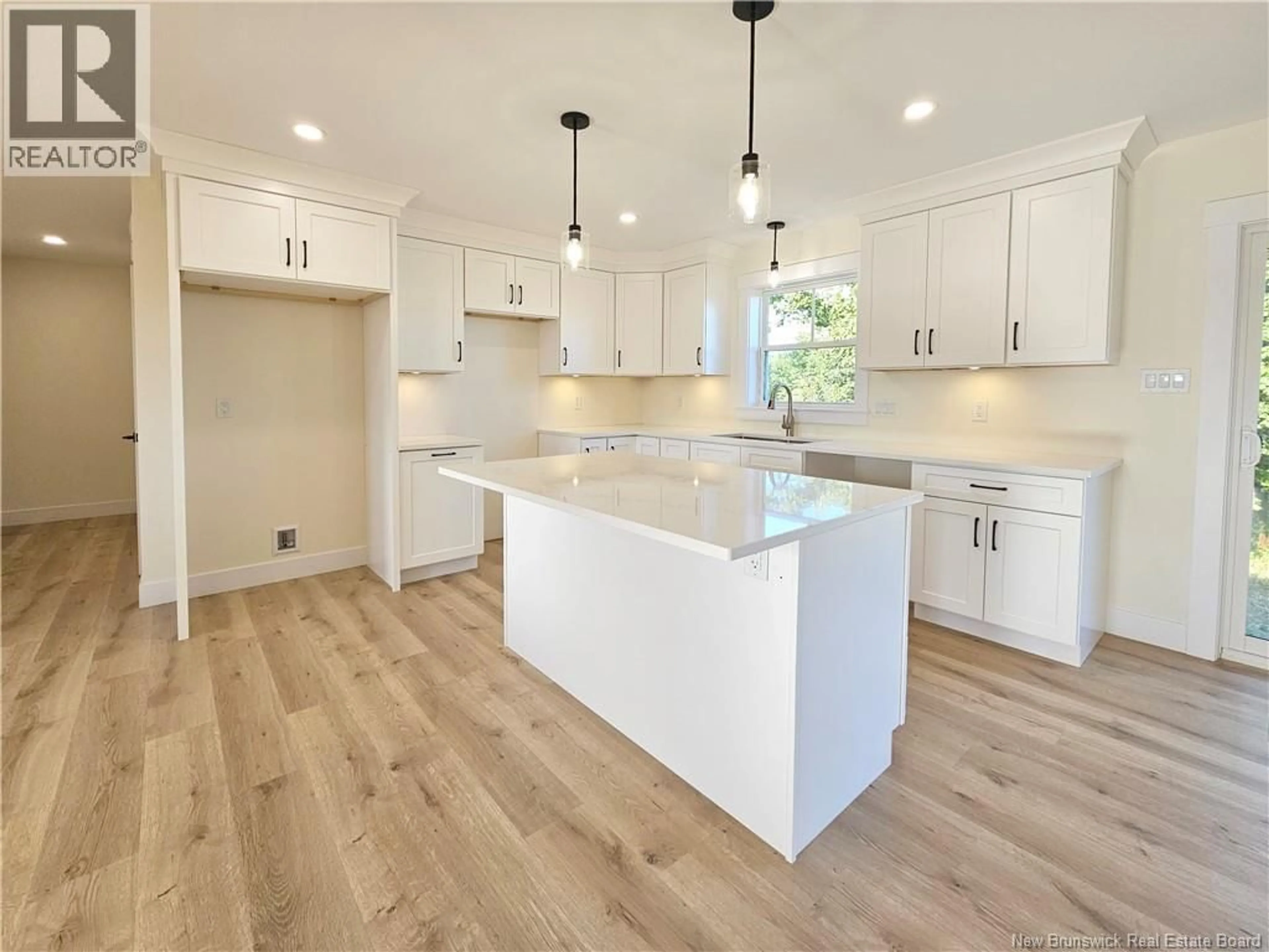 Open concept kitchen, wood/laminate floor for 19 ROBISON CRESCENT, Harvey Station New Brunswick E6K0C9