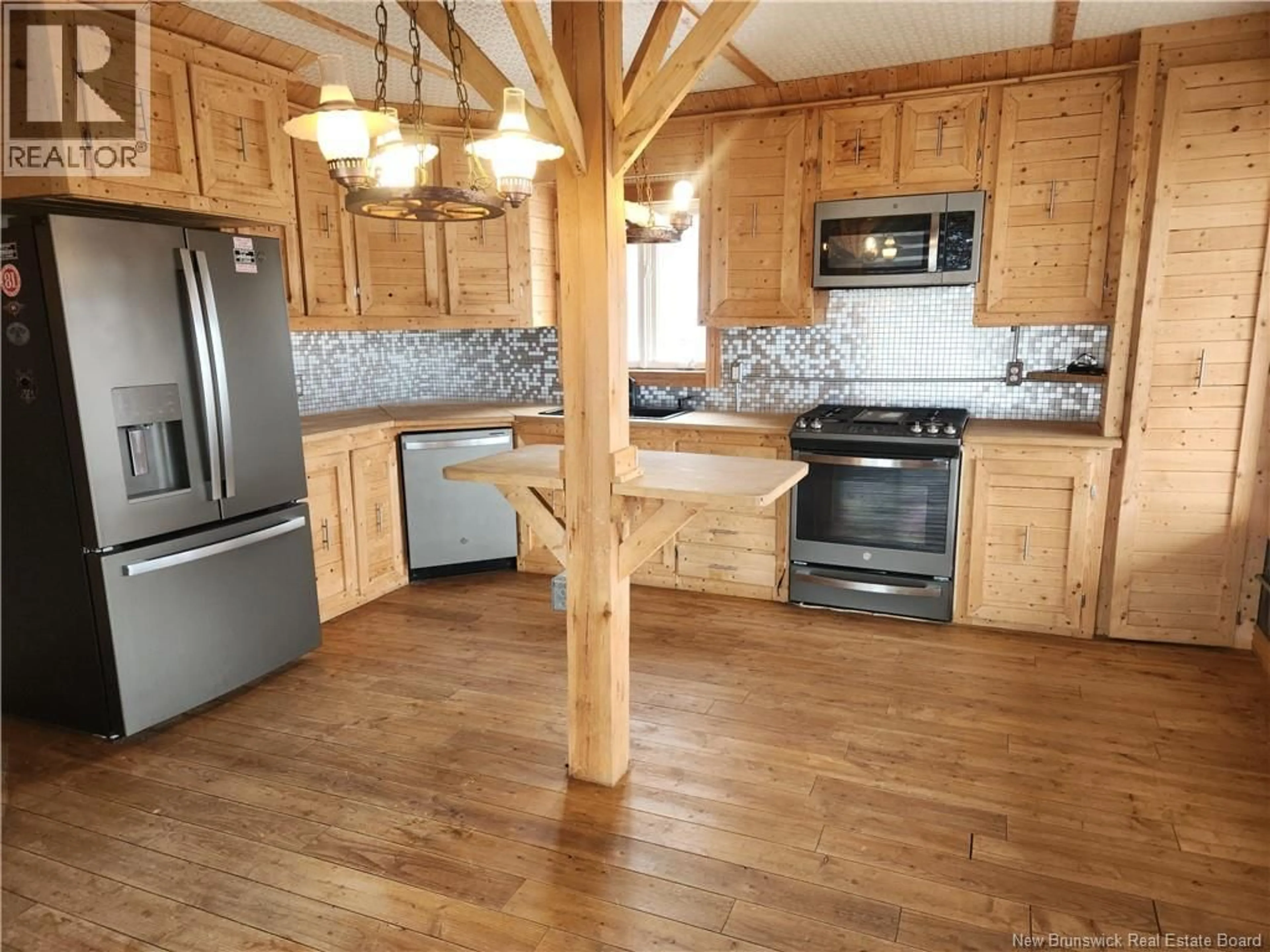 Open concept kitchen, wood/laminate floor for 19 ROUTE 265, Kedgwick River New Brunswick E8B1P9