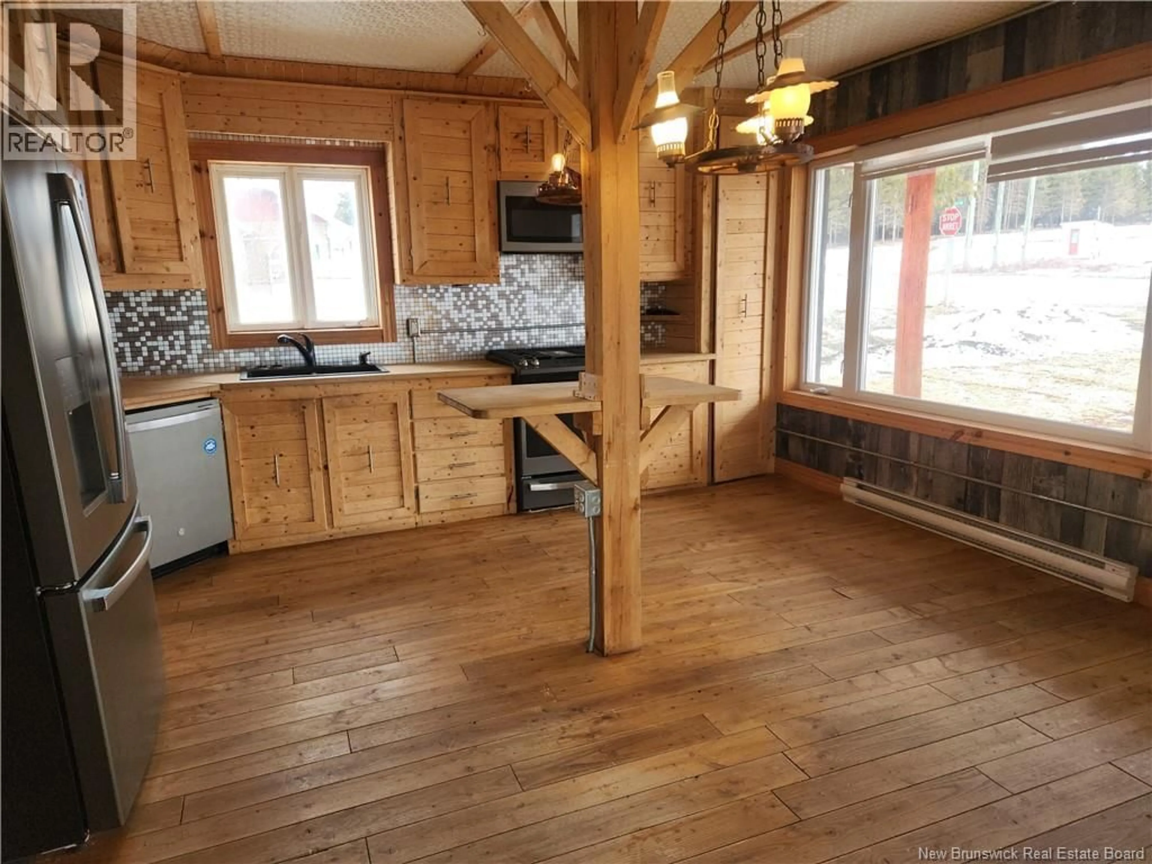 Open concept kitchen, wood/laminate floor for 19 ROUTE 265, Kedgwick River New Brunswick E8B1P9