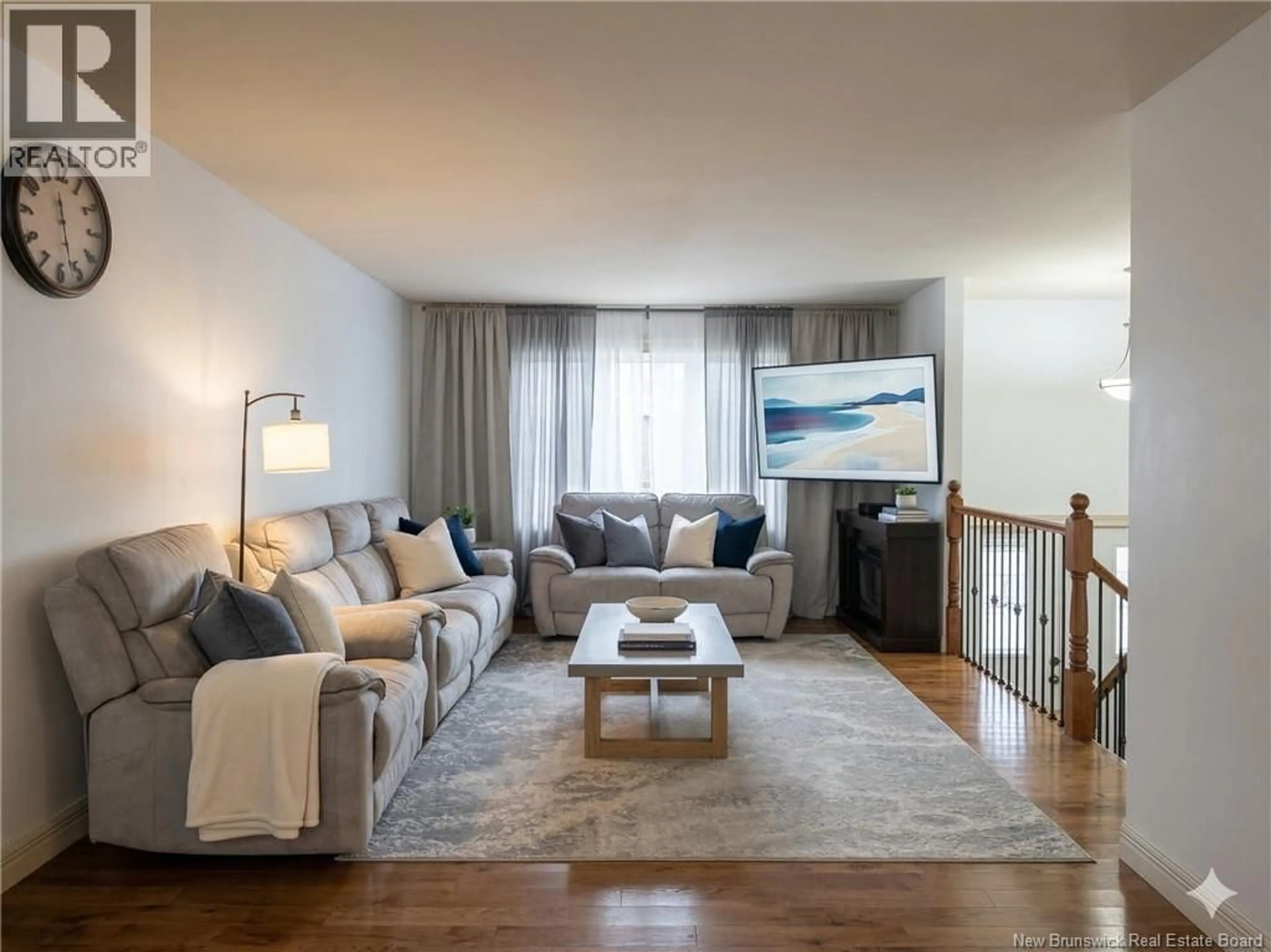 Living room with furniture, wood/laminate floor for 922 BERNARD STREET, Dieppe New Brunswick E1A5A4