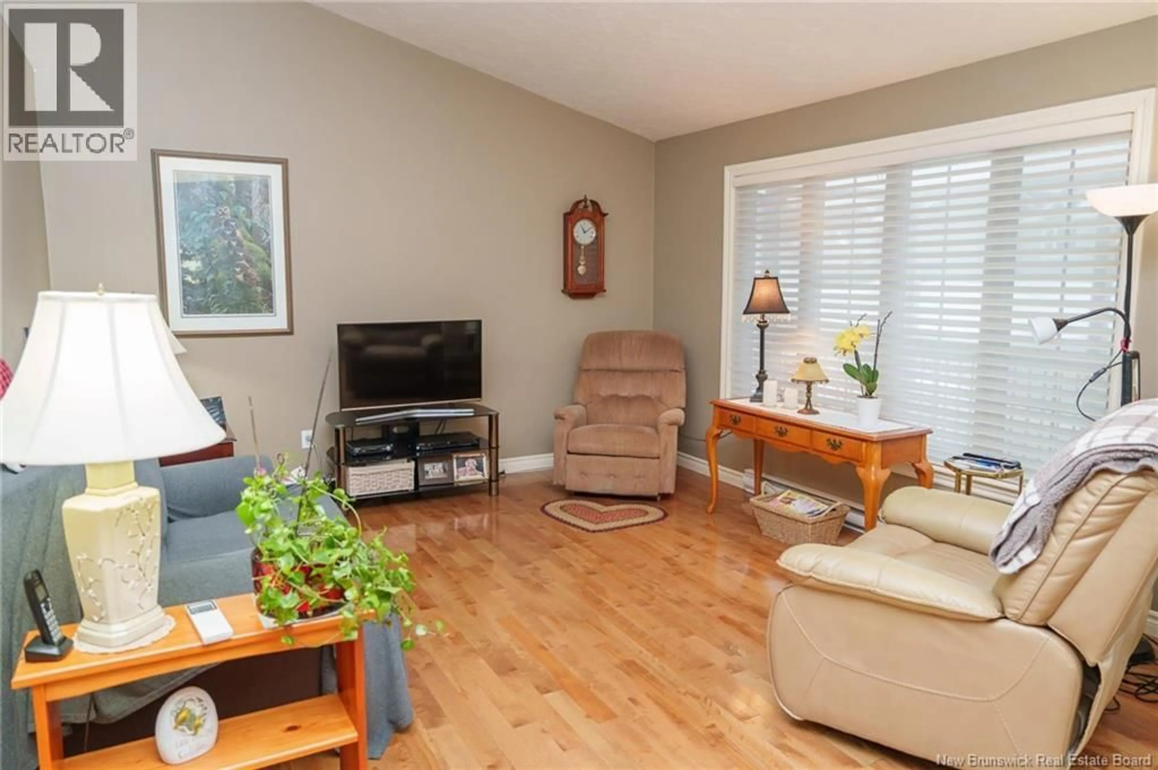 Living room with furniture, wood/laminate floor for 12 MELBA STREET, Moncton New Brunswick E1A0V8