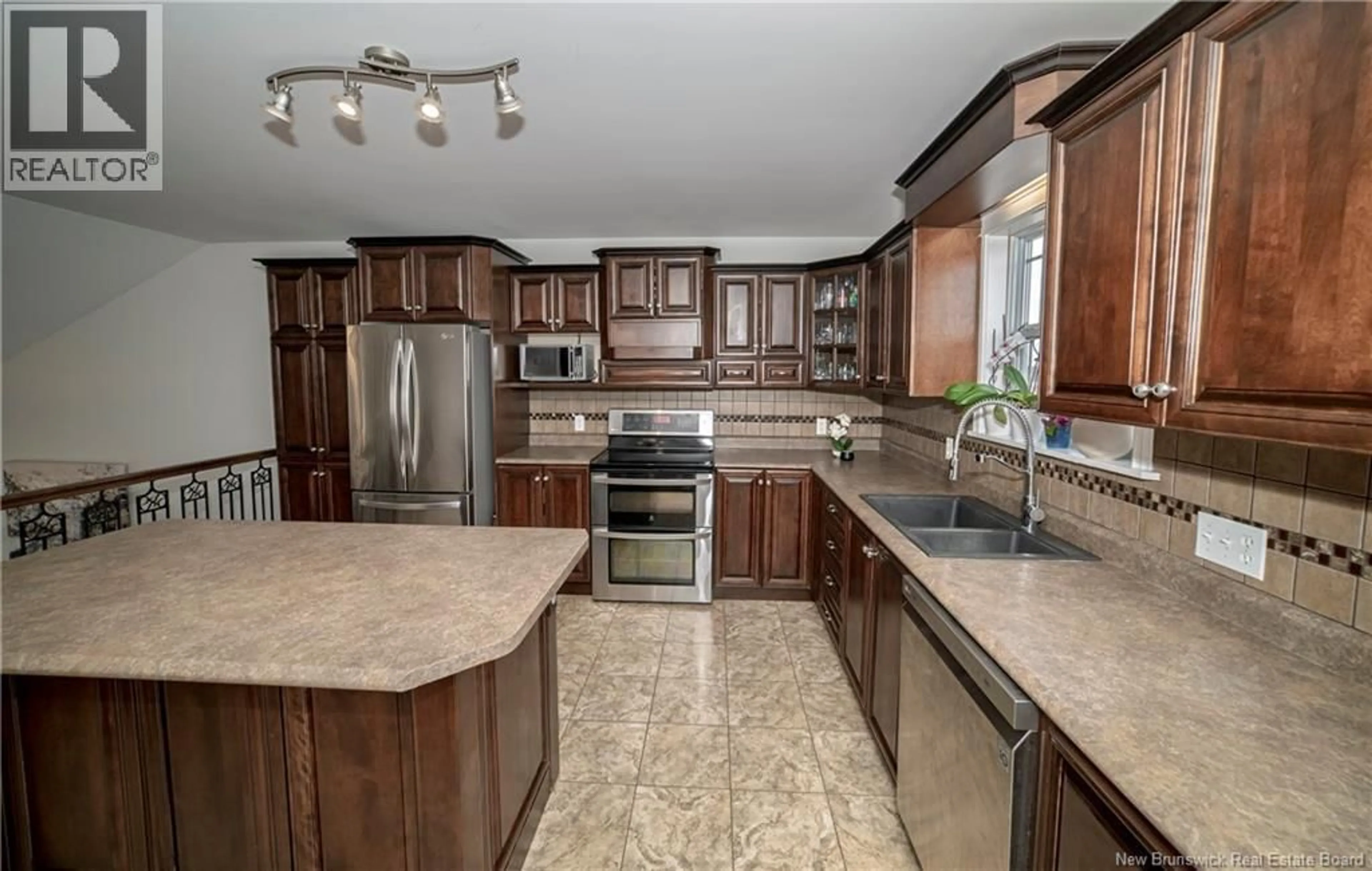 Open concept kitchen, ceramic/tile floor for 27 HALLIHAN DRIVE, Oromocto New Brunswick E2V0C2