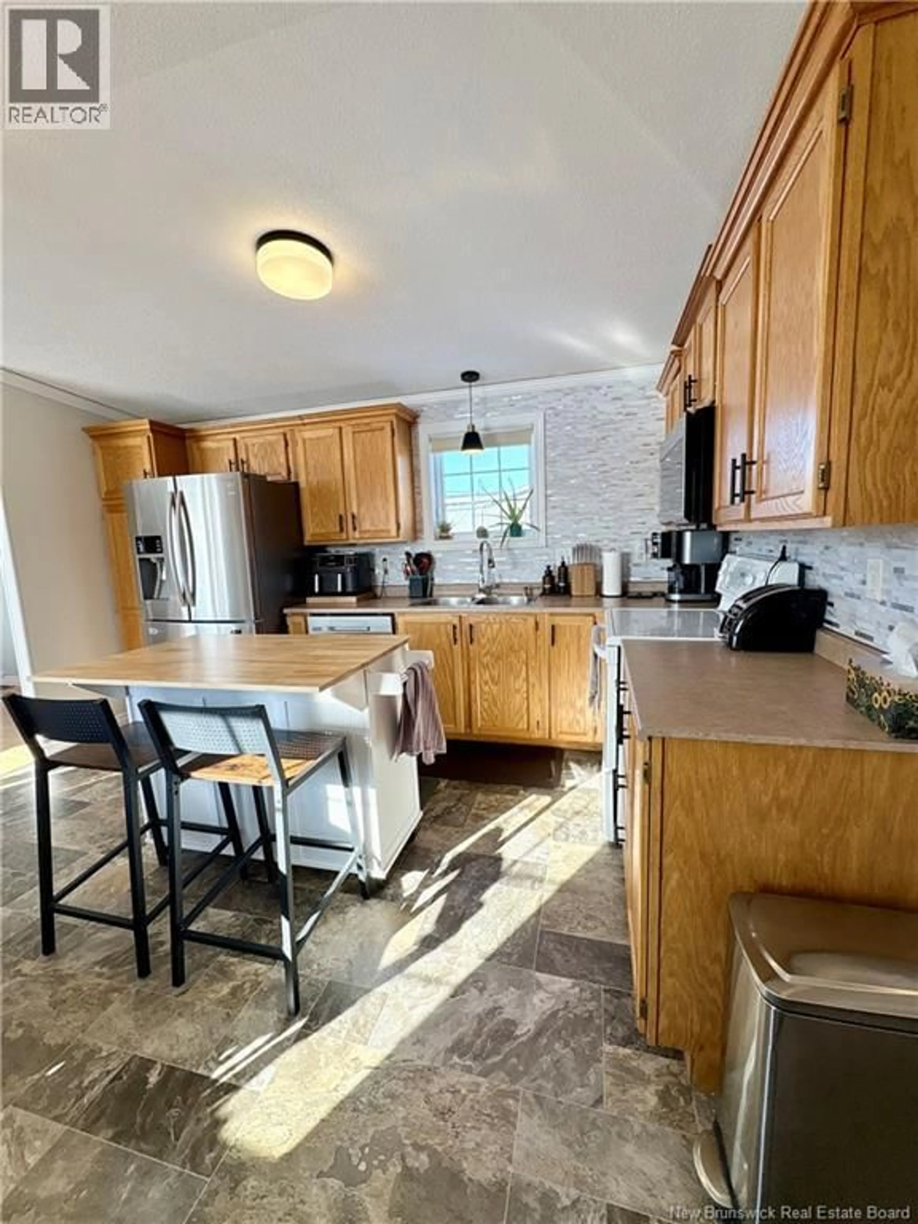 Open concept kitchen, ceramic/tile floor for 36 SOUCY STREET, Saint-Léonard New Brunswick E7E2V4