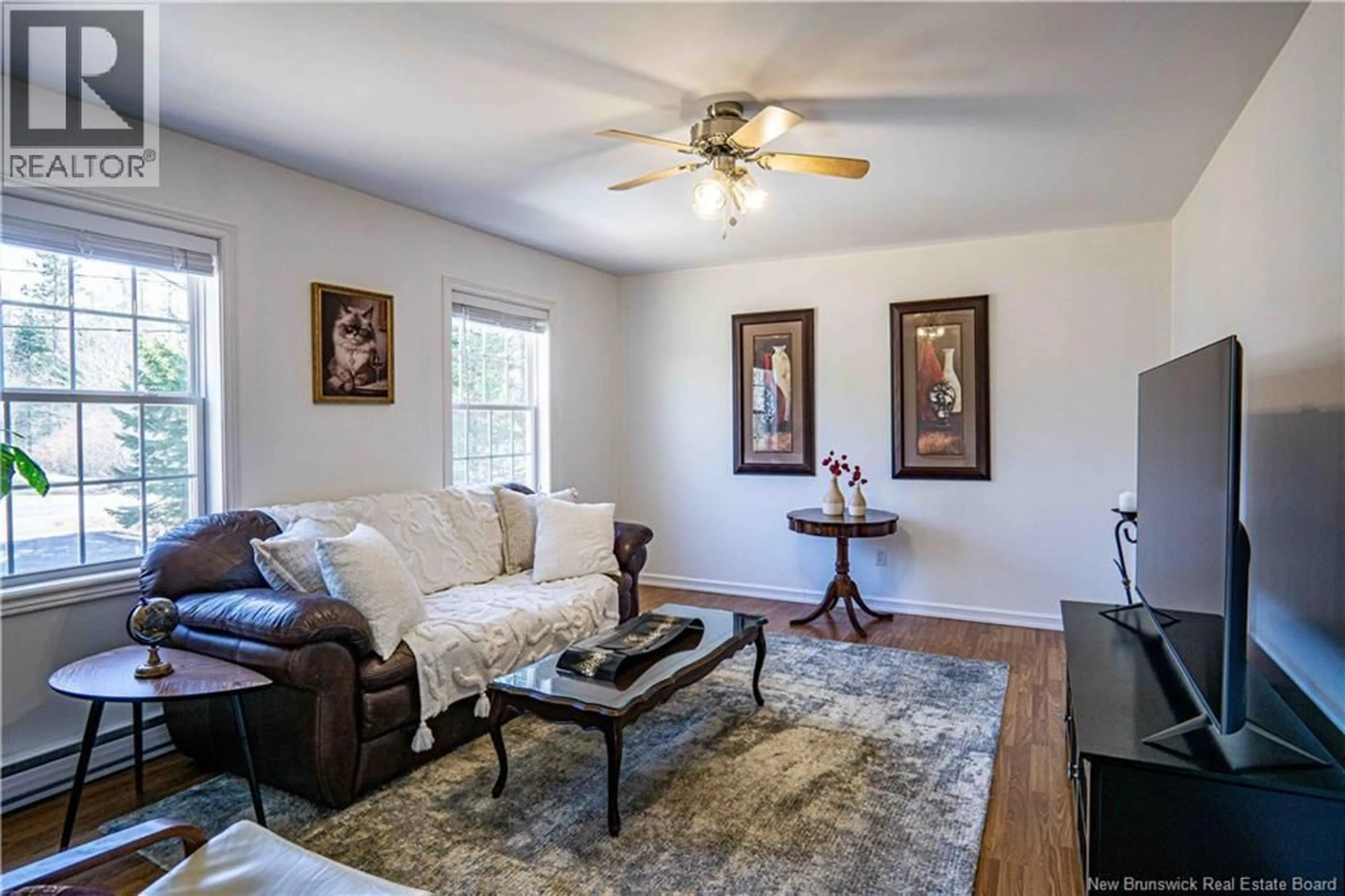 Living room with furniture, wood/laminate floor for 58 GARDEN GROVE STREET, Lincoln New Brunswick E3B7G8