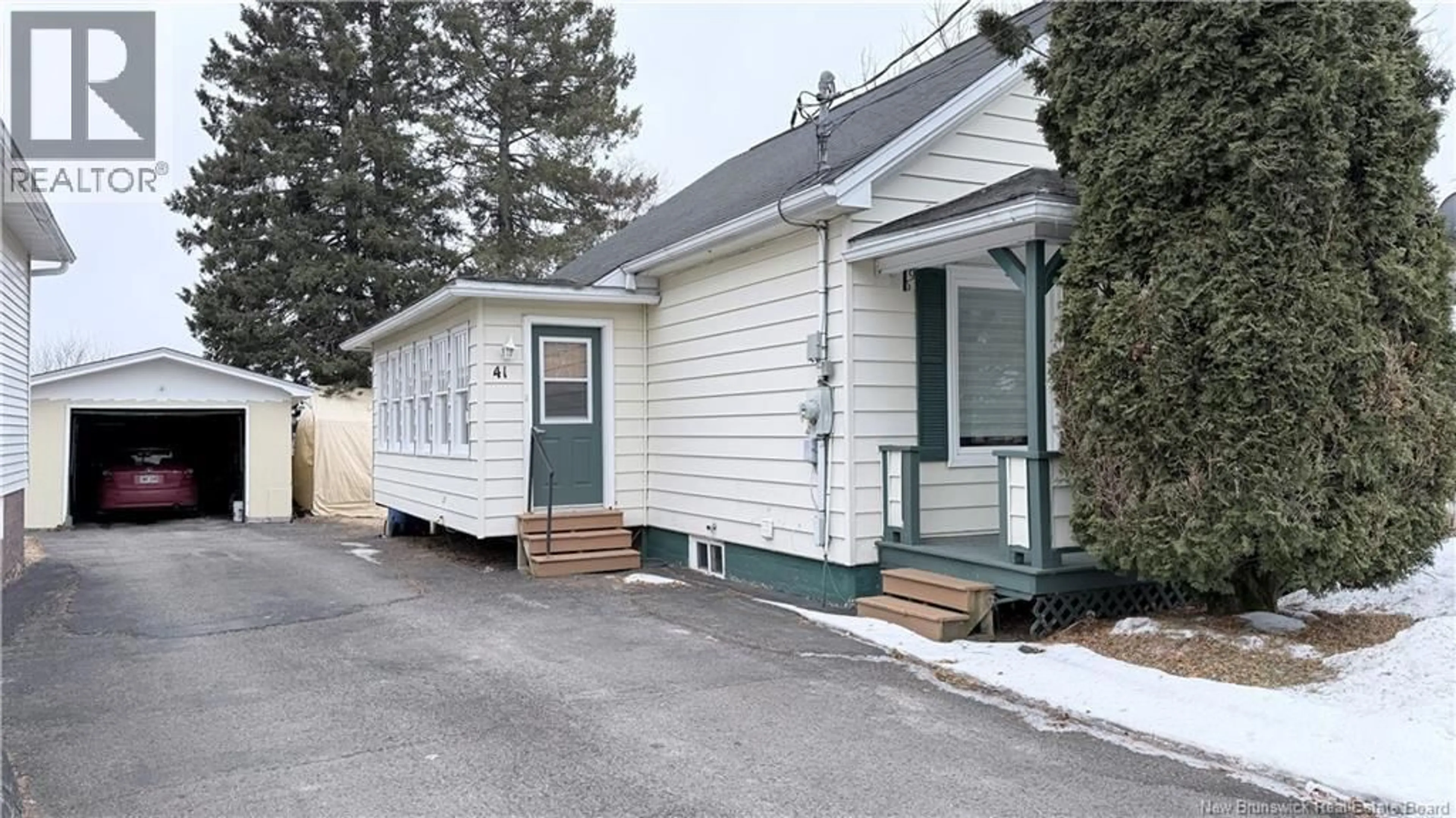 Home with vinyl exterior material, street for 41 LAPOINTE STREET, Saint-Léonard New Brunswick E7E1X3