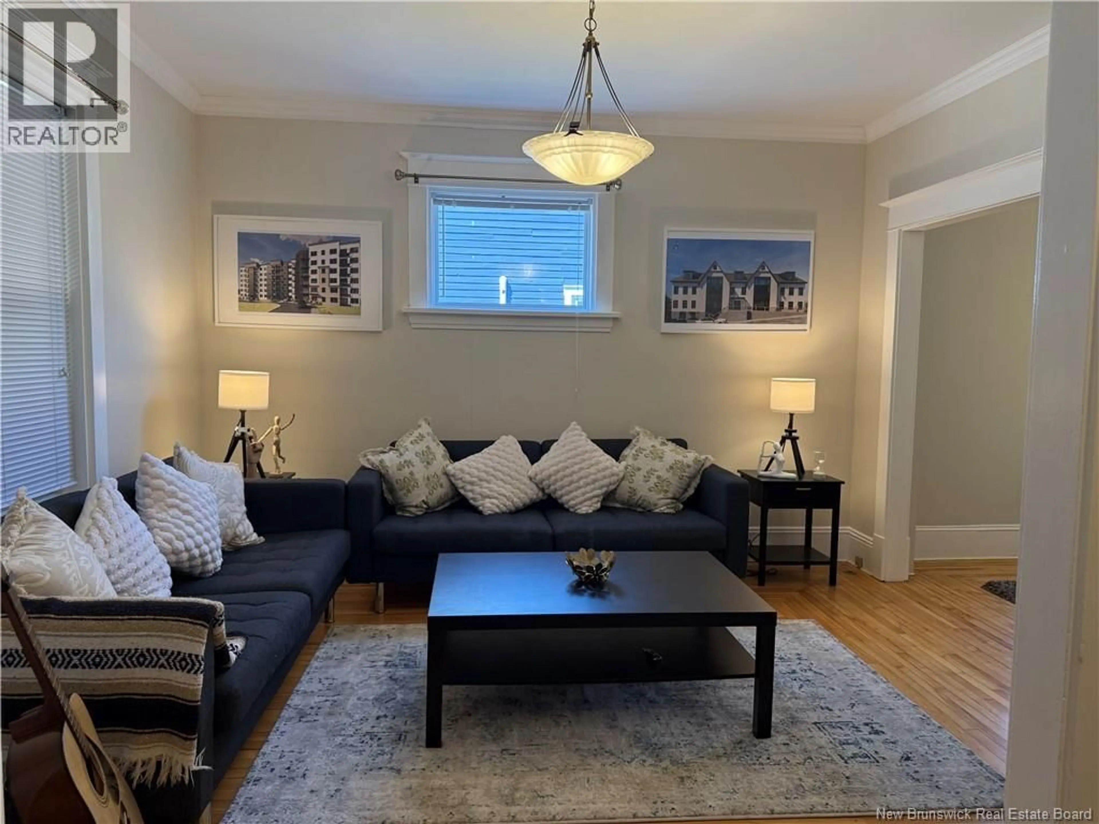 Living room with furniture, wood/laminate floor for 65-67 DOMINION STREET, Moncton New Brunswick E1C6G6