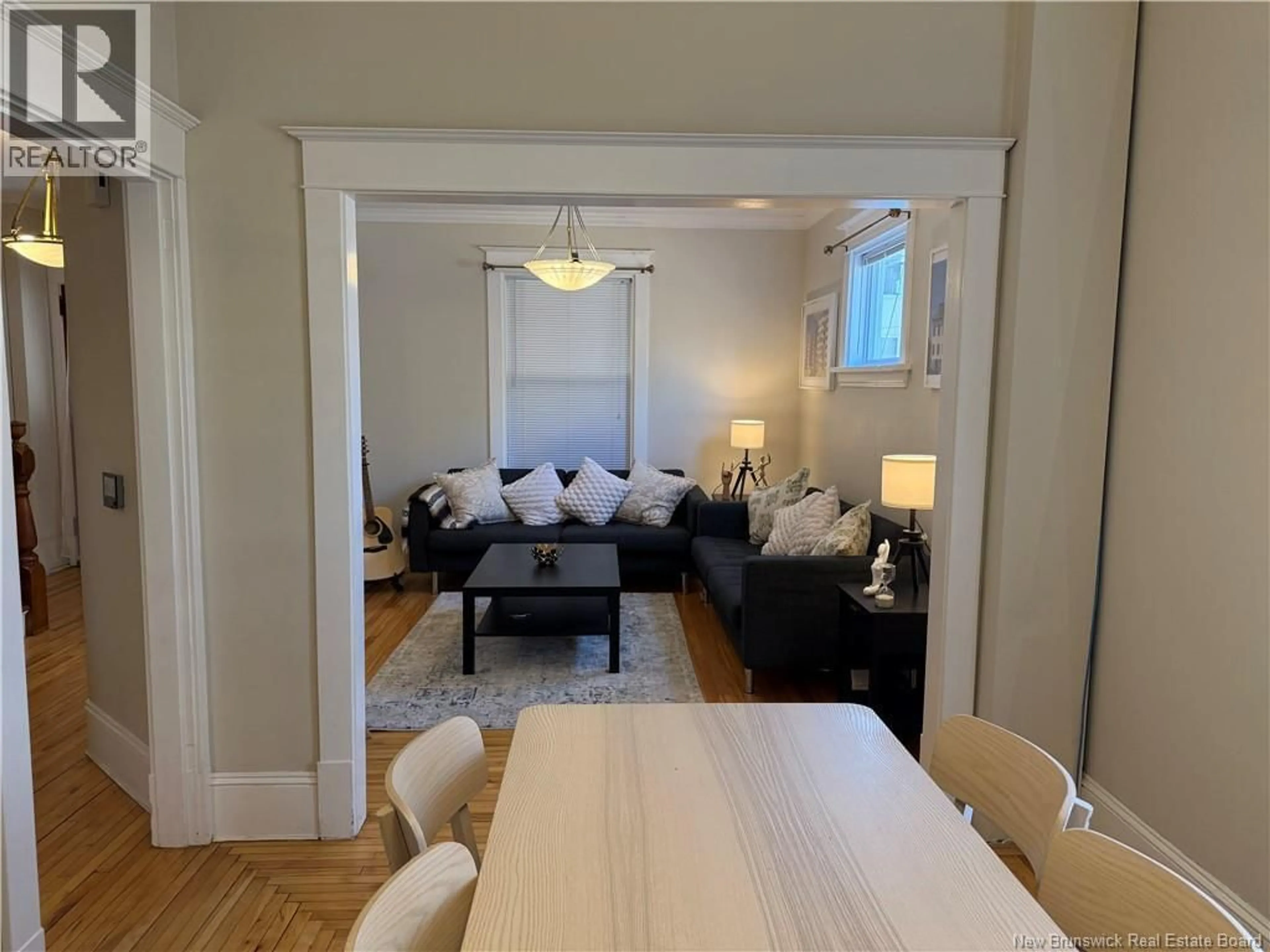 Living room with furniture, wood/laminate floor for 65-67 DOMINION STREET, Moncton New Brunswick E1C6G6