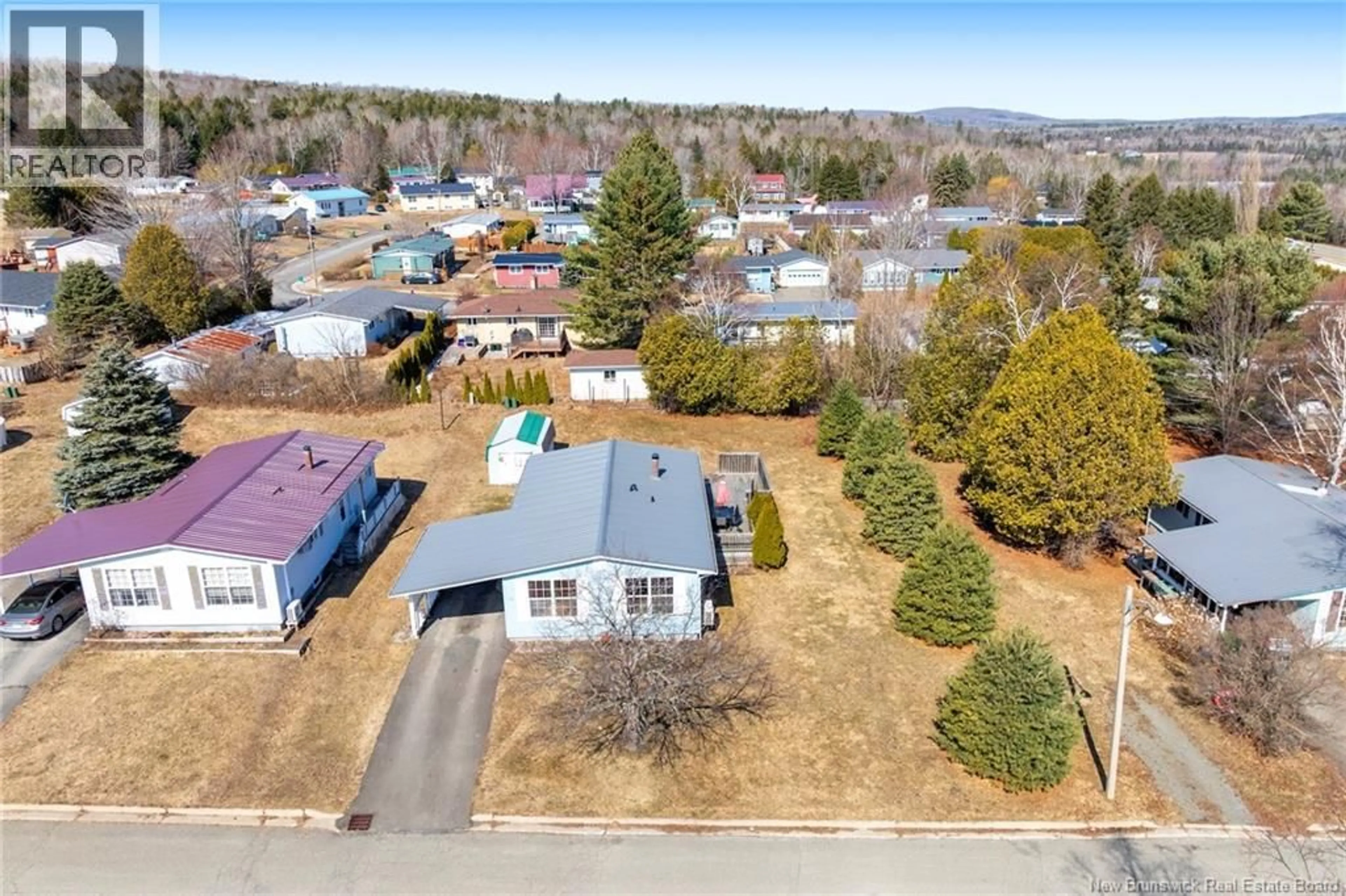 A pic from outside/outdoor area/front of a property/back of a property/a pic from drone, street for 24 MCLAREN CRESCENT, Nackawic New Brunswick E6G1C7