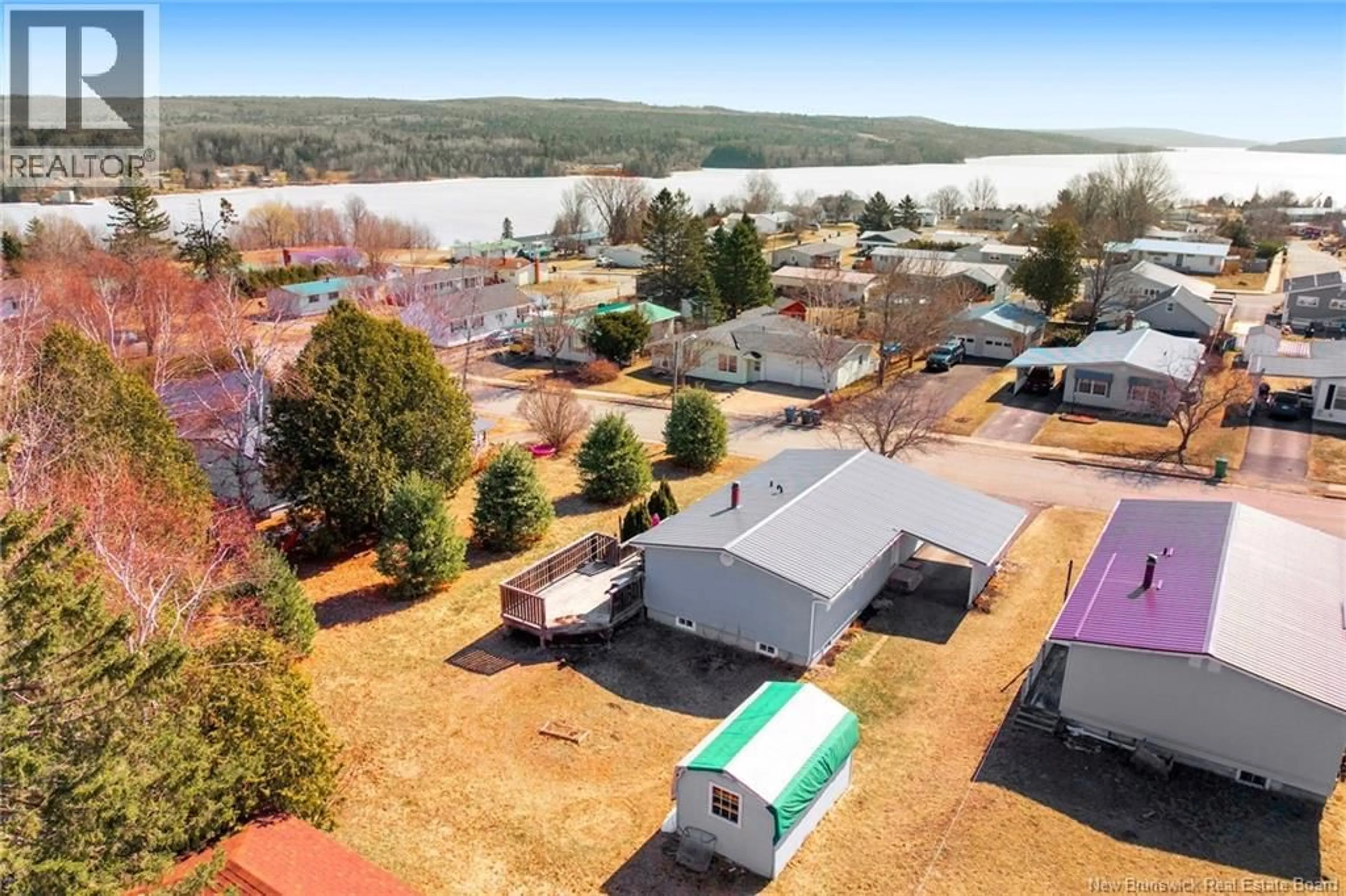 A pic from outside/outdoor area/front of a property/back of a property/a pic from drone, water/lake/river/ocean view for 24 MCLAREN CRESCENT, Nackawic New Brunswick E6G1C7