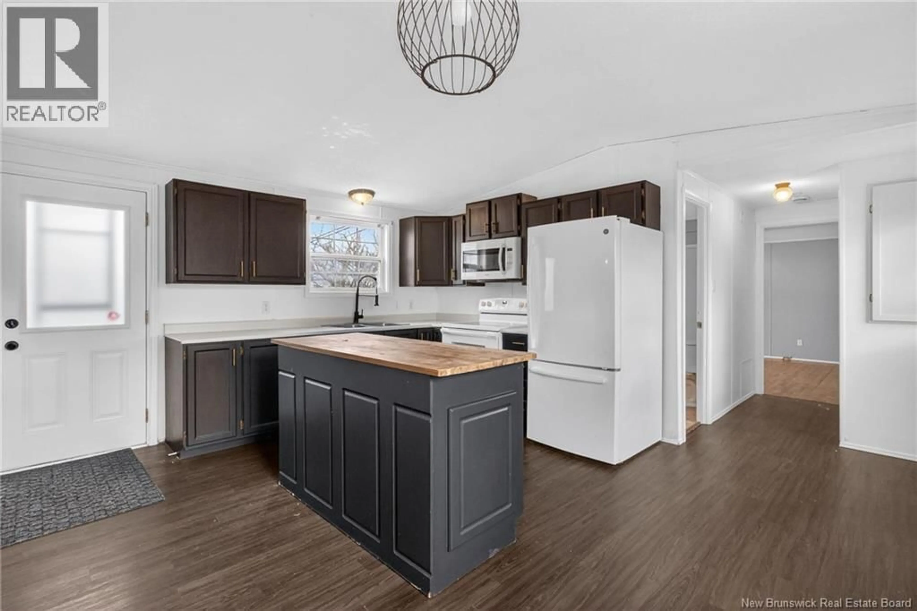 Open concept kitchen, wood/laminate floor for 26 CAROUGE, Moncton New Brunswick E1N2T4