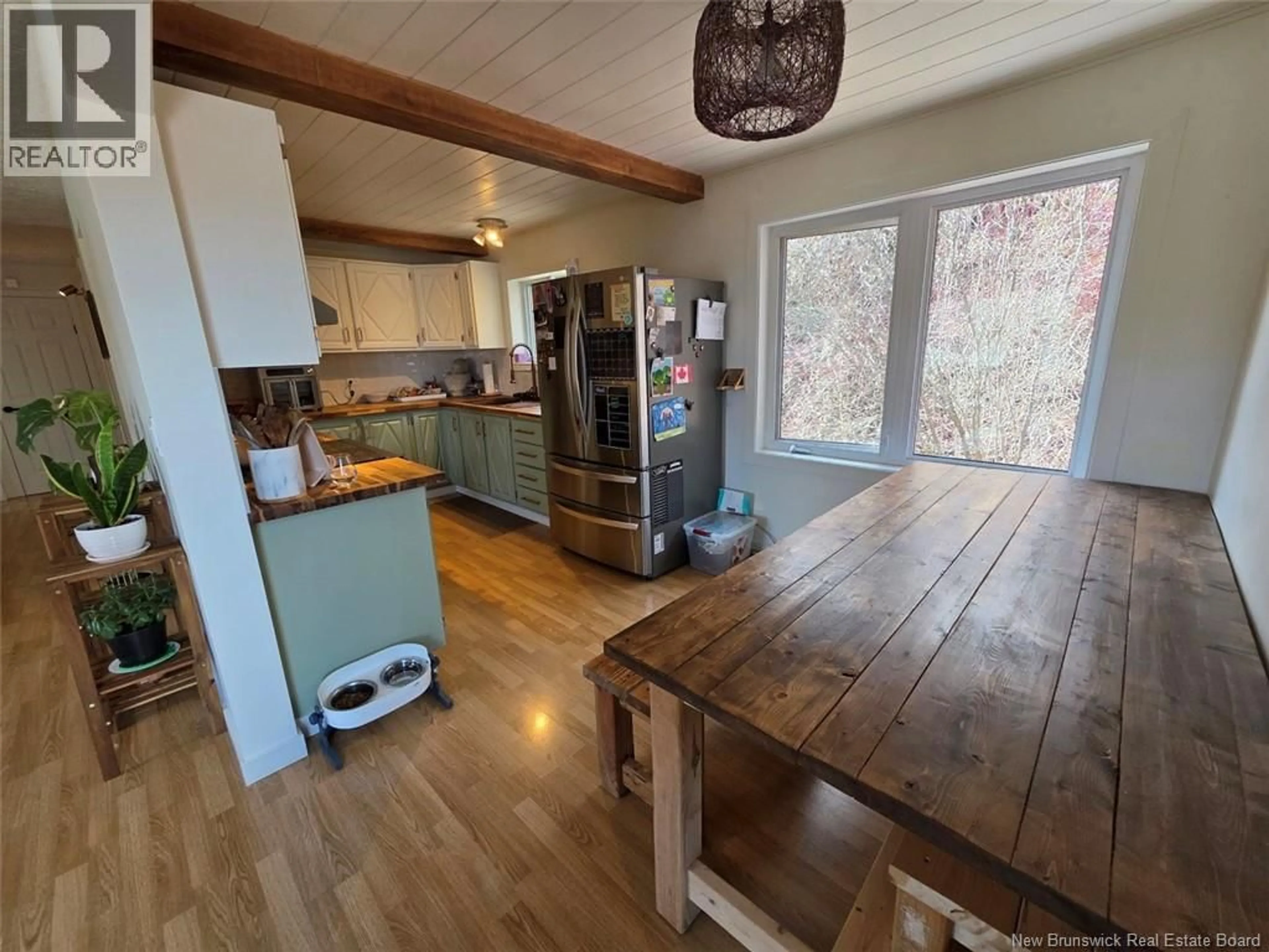 Open concept kitchen, wood/laminate floor for 5722 CENTRALE STREET, Lac Baker New Brunswick E7A1N6