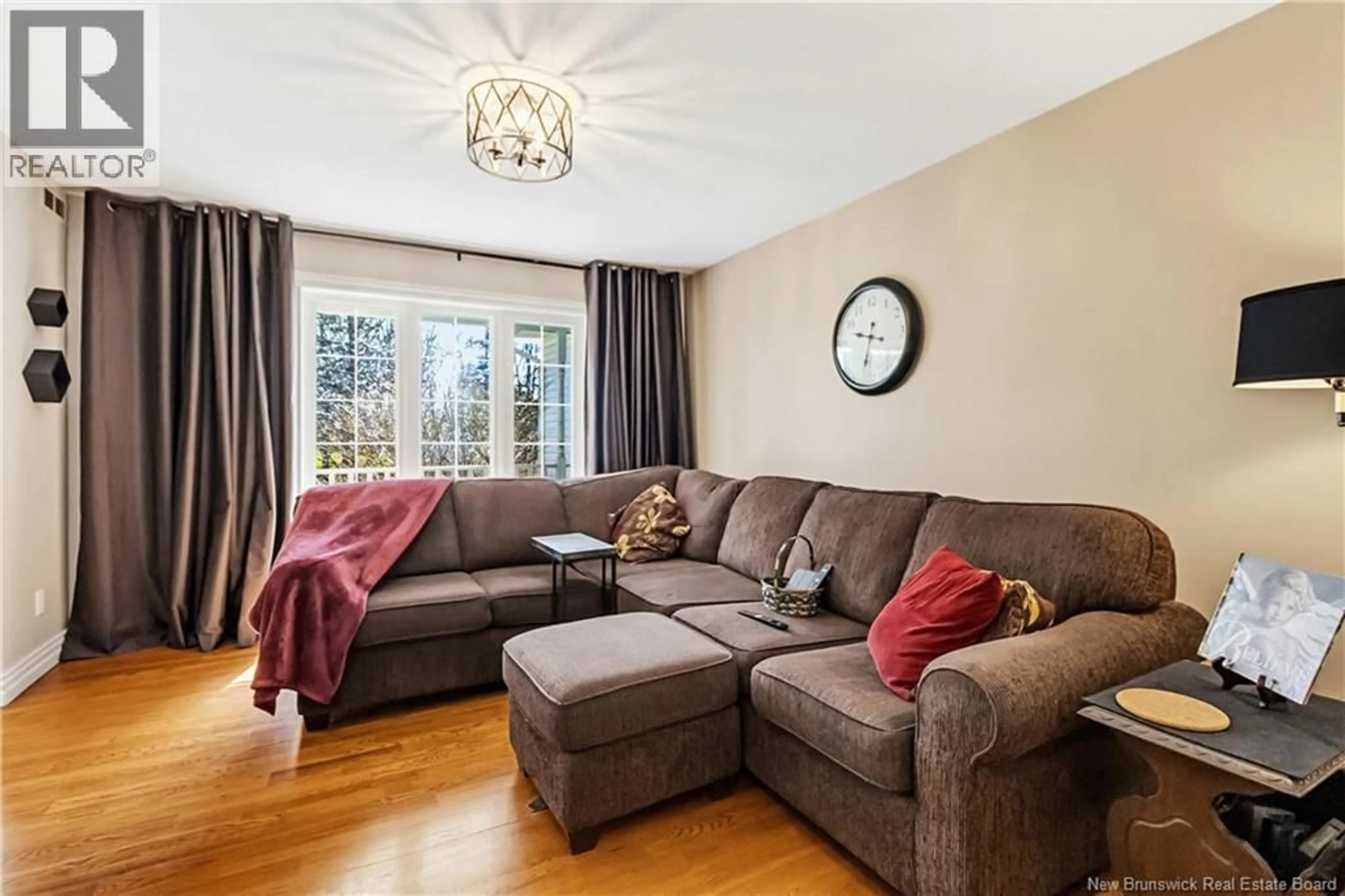 Living room with furniture, wood/laminate floor for 70 MCAULEY DRIVE, Moncton New Brunswick E1A6K1