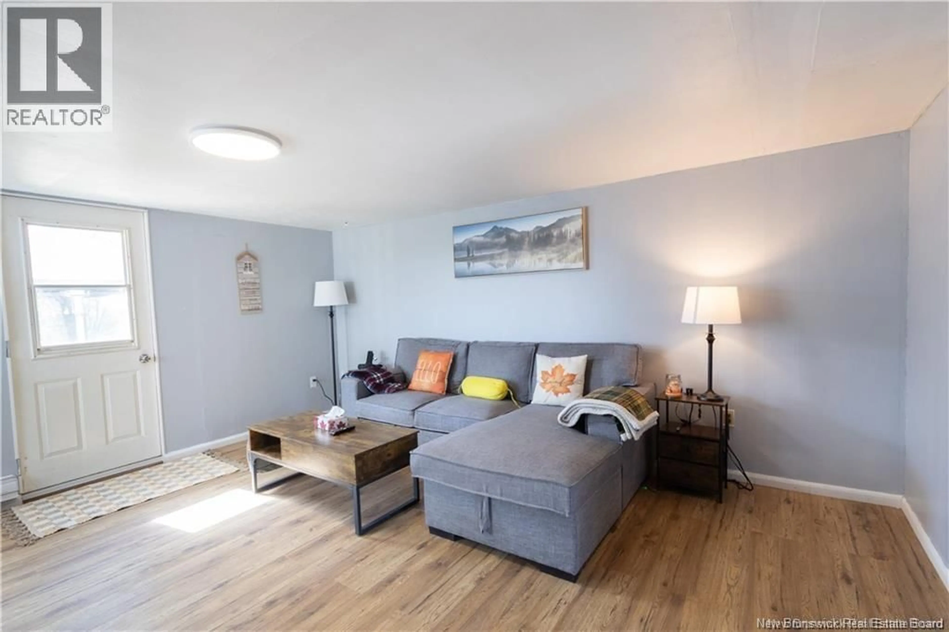 Living room with furniture, wood/laminate floor for 3222 ROUTE 104, Upper Hainesville New Brunswick E6E1J1