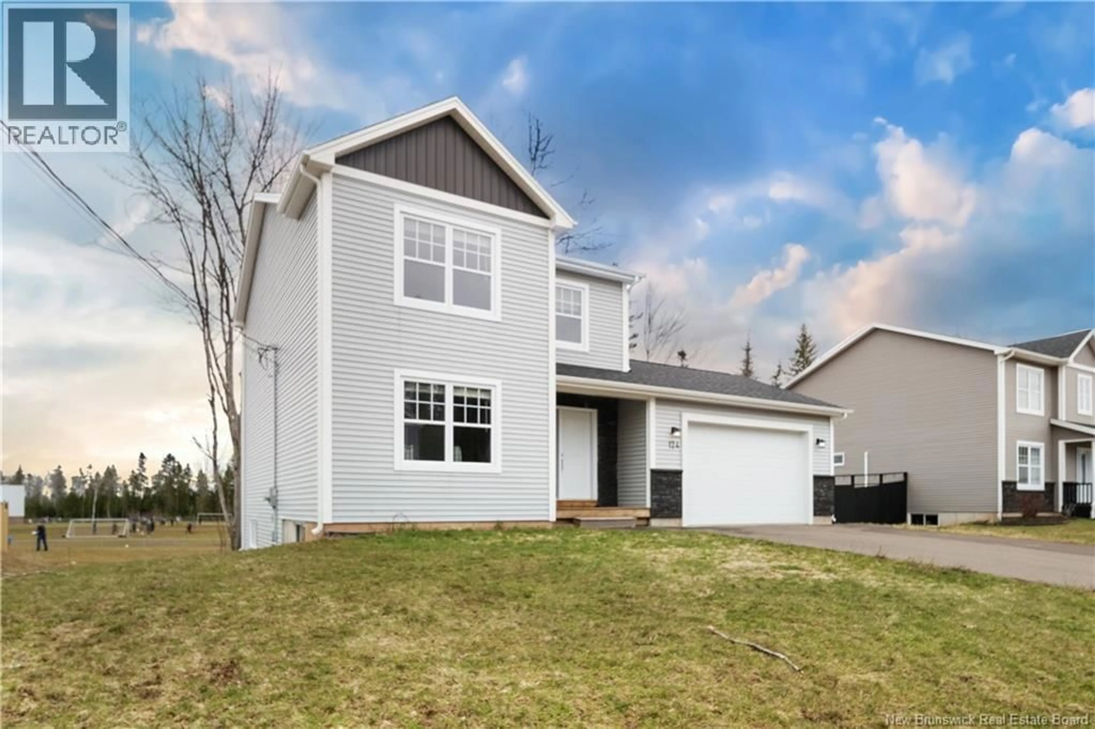 Home with vinyl exterior material, street for 124 DES ELEVES, Dieppe New Brunswick E1A4V6