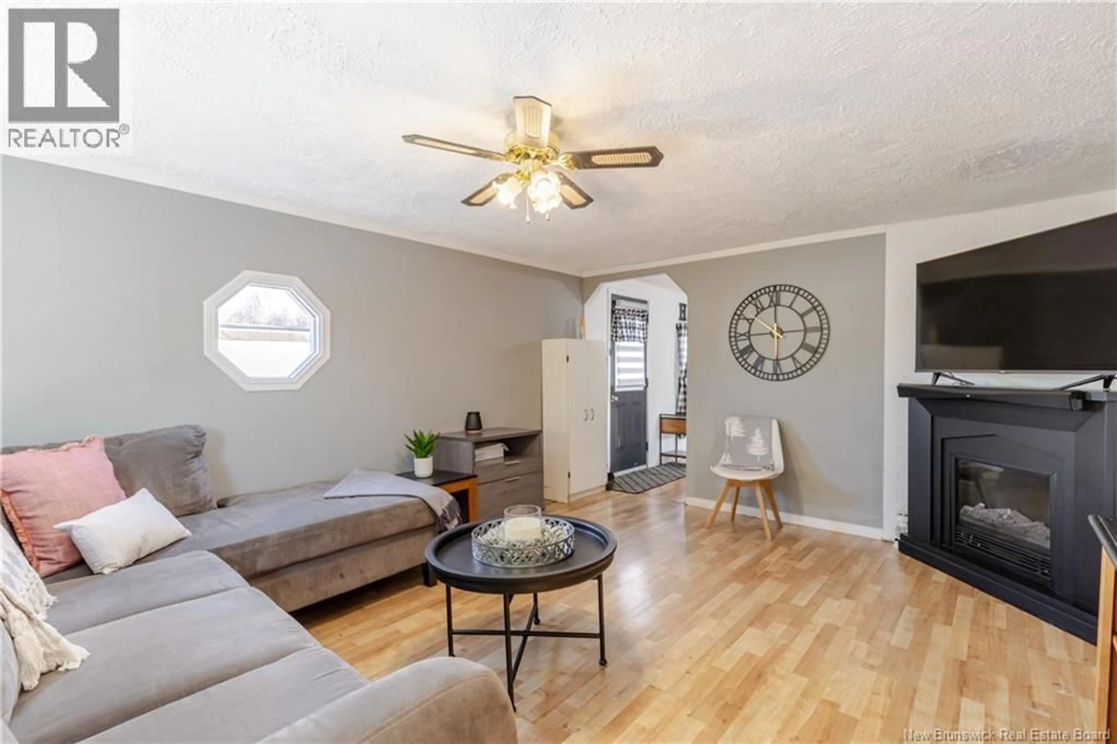 Living room with furniture, wood/laminate floor for 34 ELMDALE CRESCENT, Fredericton New Brunswick E3B6R1