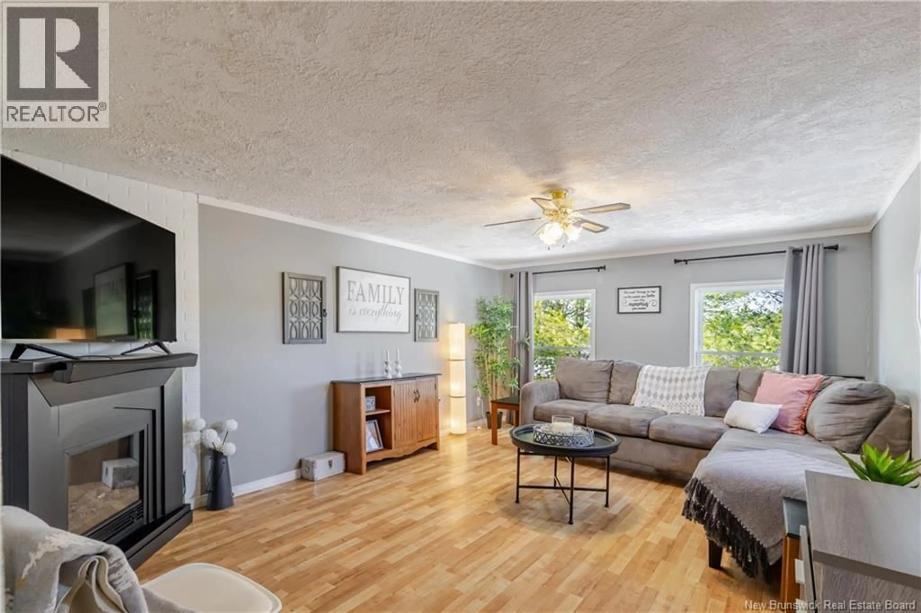 Living room with furniture, wood/laminate floor for 34 ELMDALE CRESCENT, Fredericton New Brunswick E3B6R1