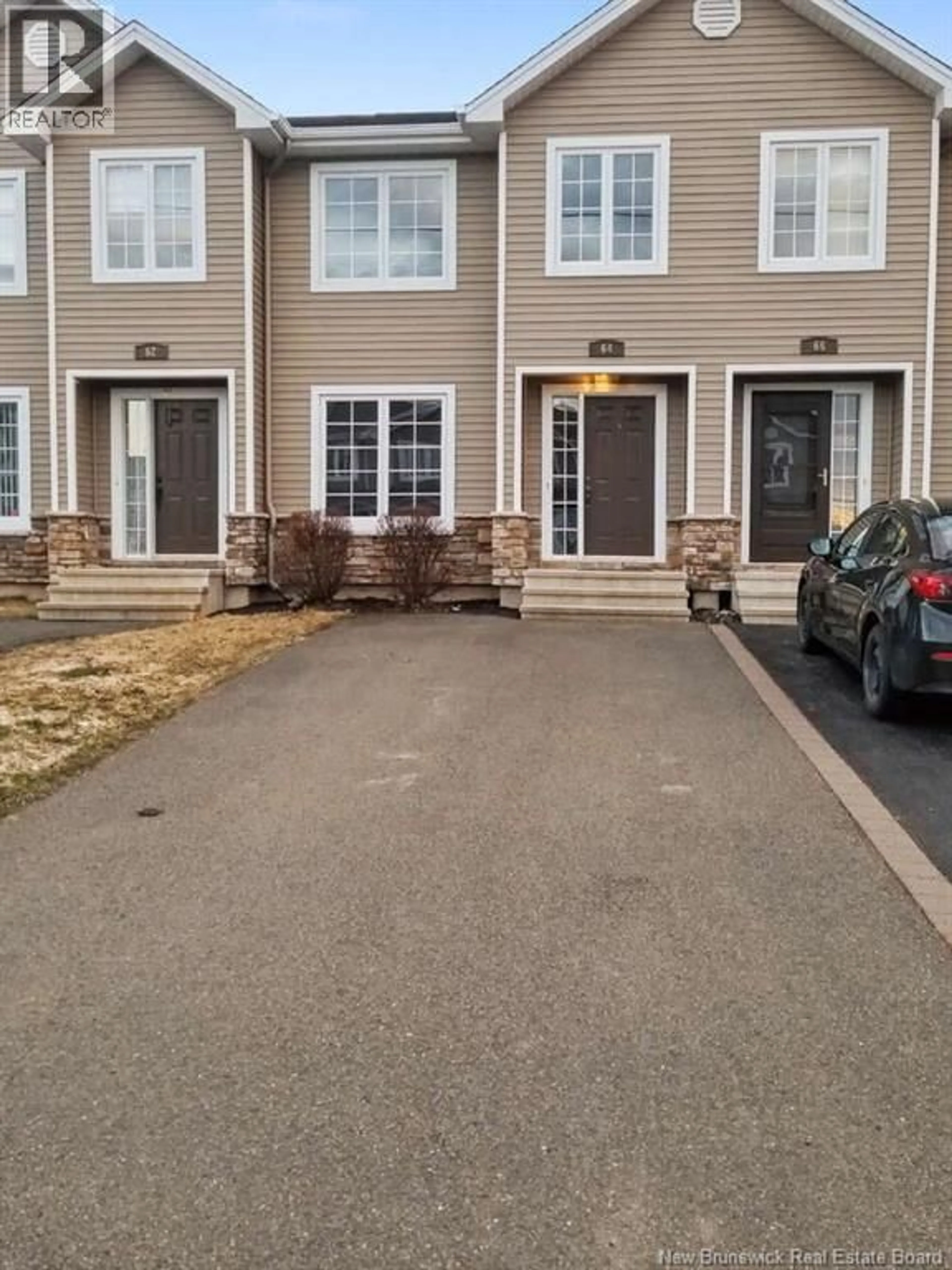 A pic from outside/outdoor area/front of a property/back of a property/a pic from drone, street for 64 RUE LIONEL, Dieppe New Brunswick E1E4V3
