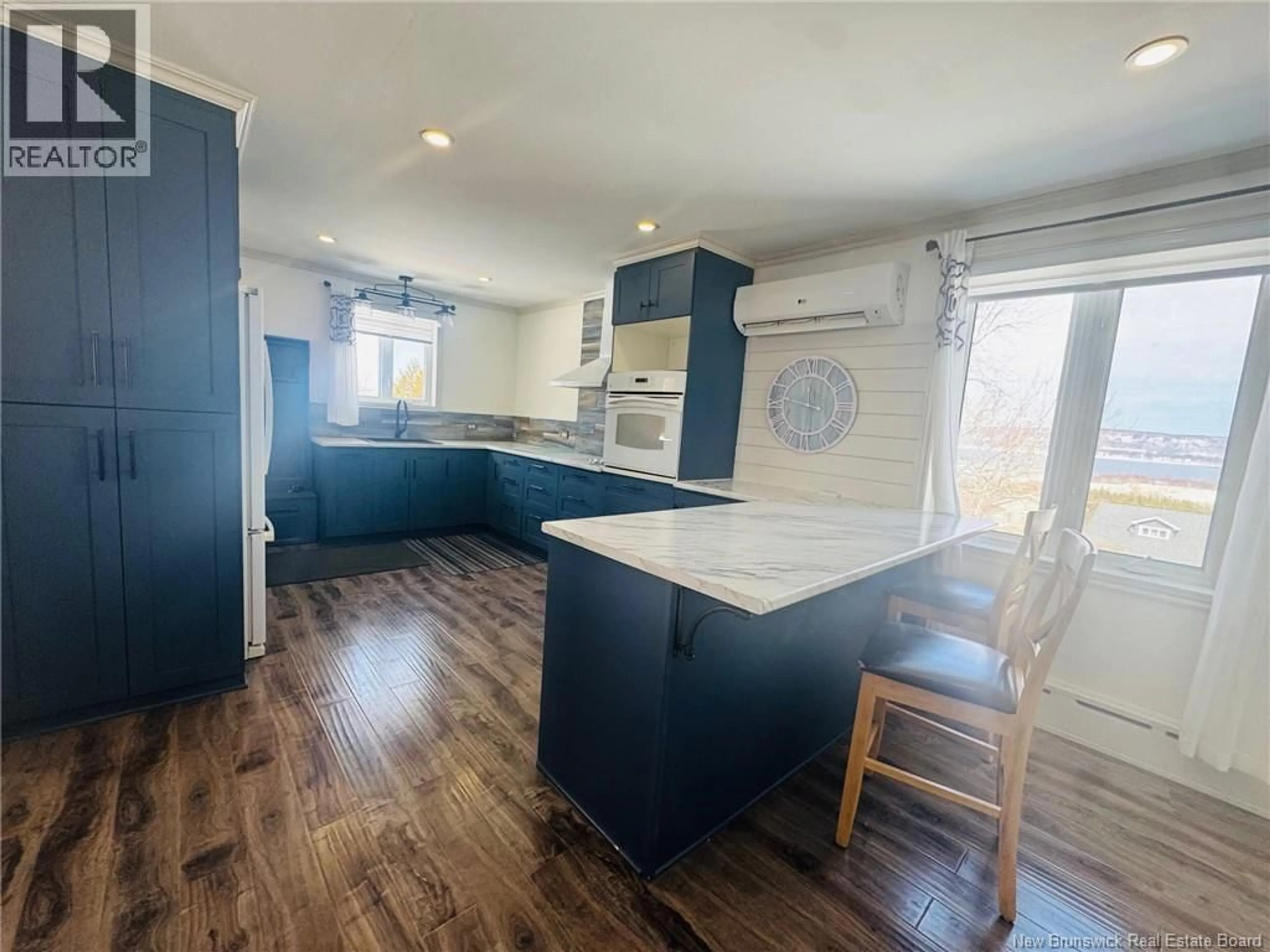 Open concept kitchen, wood/laminate floor for 345 VICTORIA STREET, Dalhousie New Brunswick E8C2T7