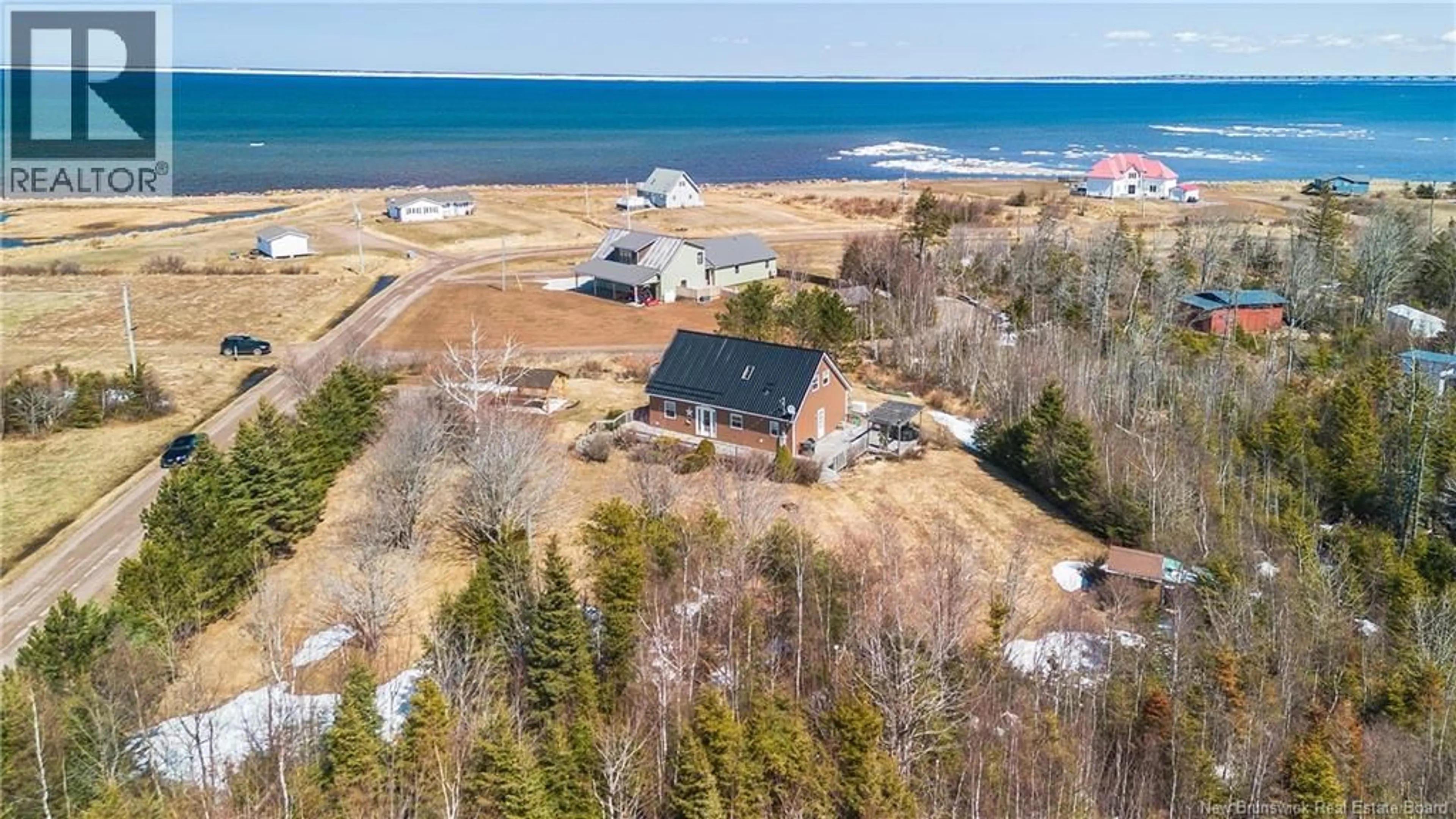 A pic from outside/outdoor area/front of a property/back of a property/a pic from drone, water/lake/river/ocean view for 9 SPENCES BEACH ROAD, Murray Corner New Brunswick E4M3R4