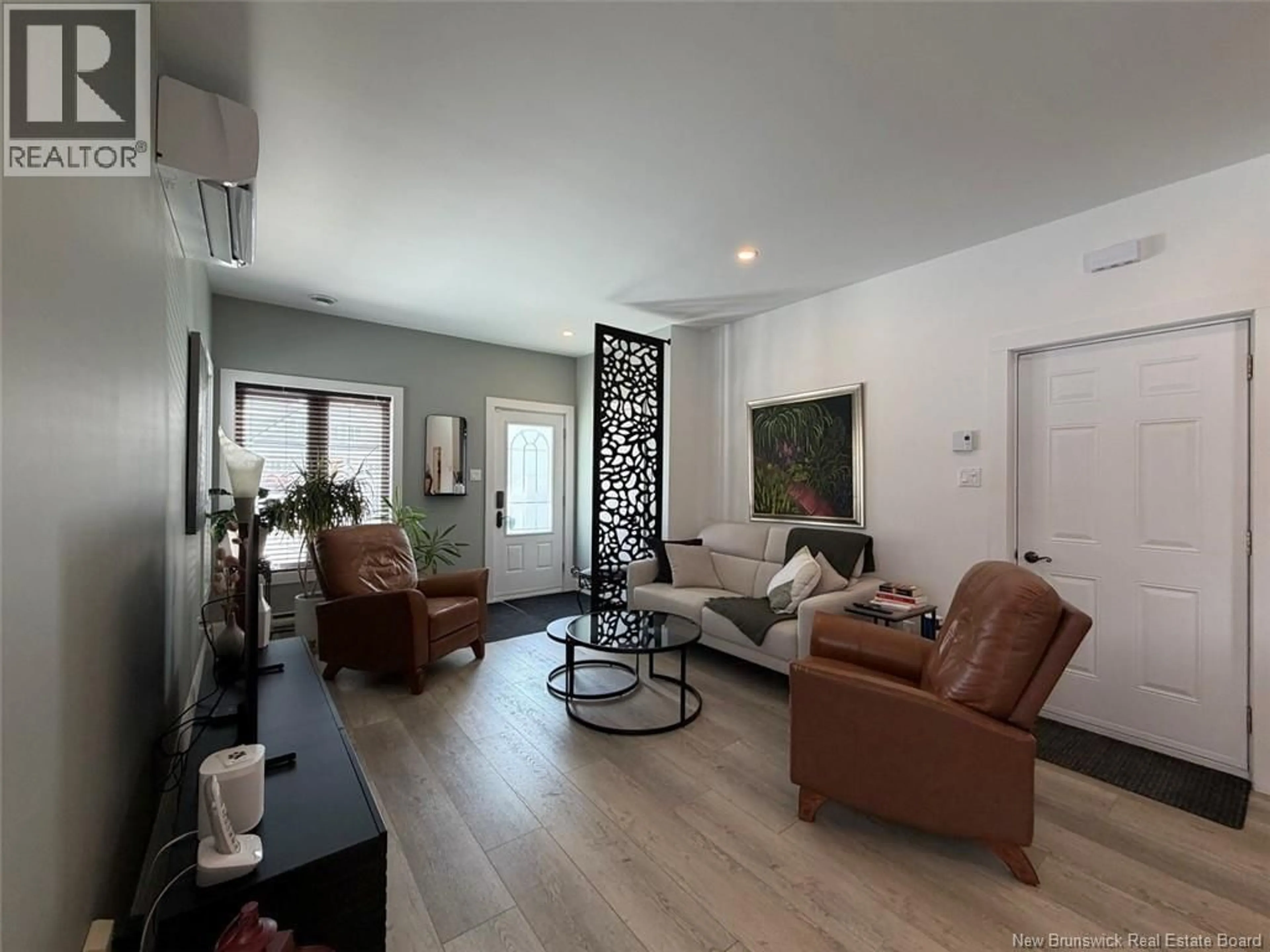 Living room with furniture, wood/laminate floor for 8 LOUISE STREET, Edmundston New Brunswick E3V0C3