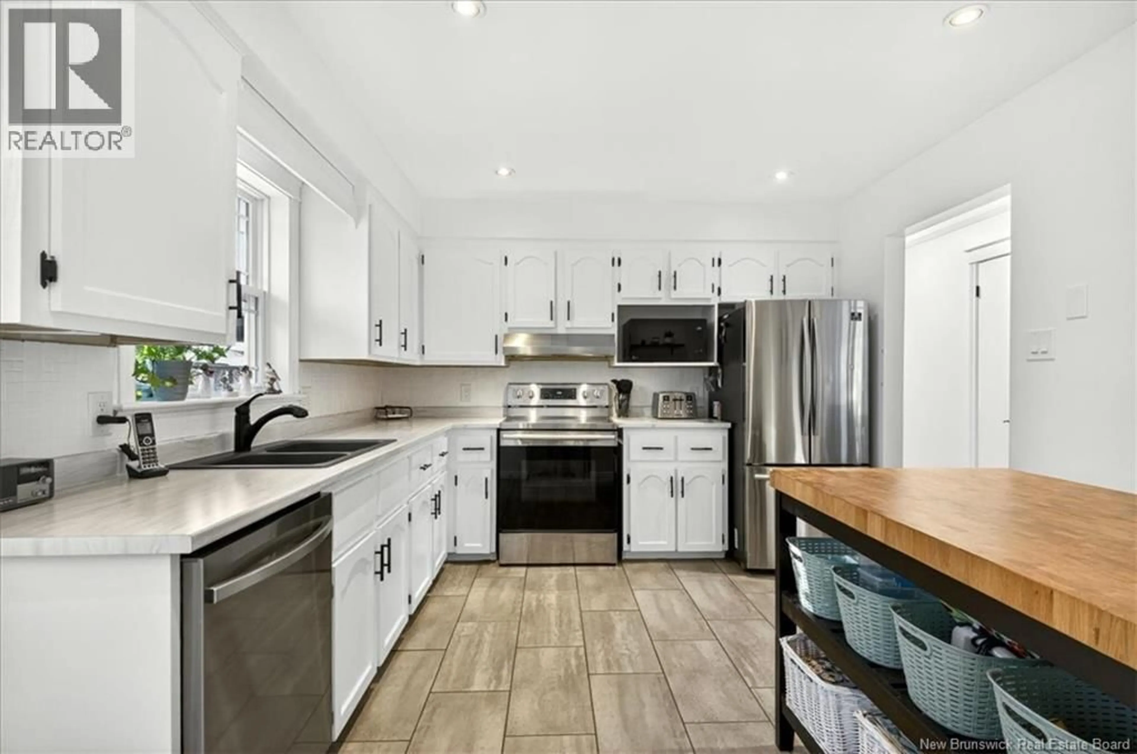 Open concept kitchen, ceramic/tile floor for 15 LYMAN DRIVE, Quispamsis New Brunswick E2E4L2