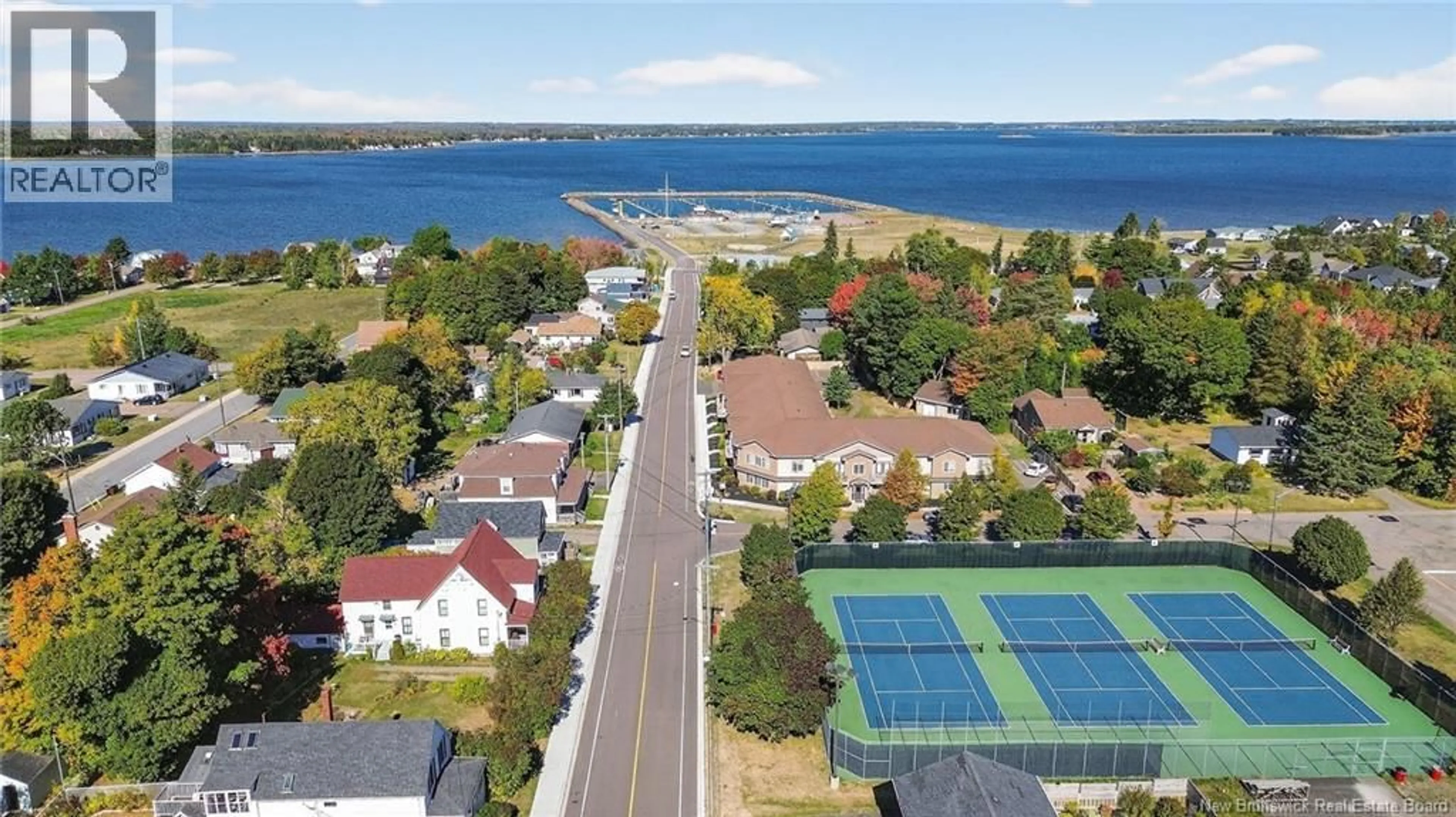 A pic from outside/outdoor area/front of a property/back of a property/a pic from drone, water/lake/river/ocean view for 201 - 98 PLEASANT STREET, Shediac New Brunswick E4P2L6