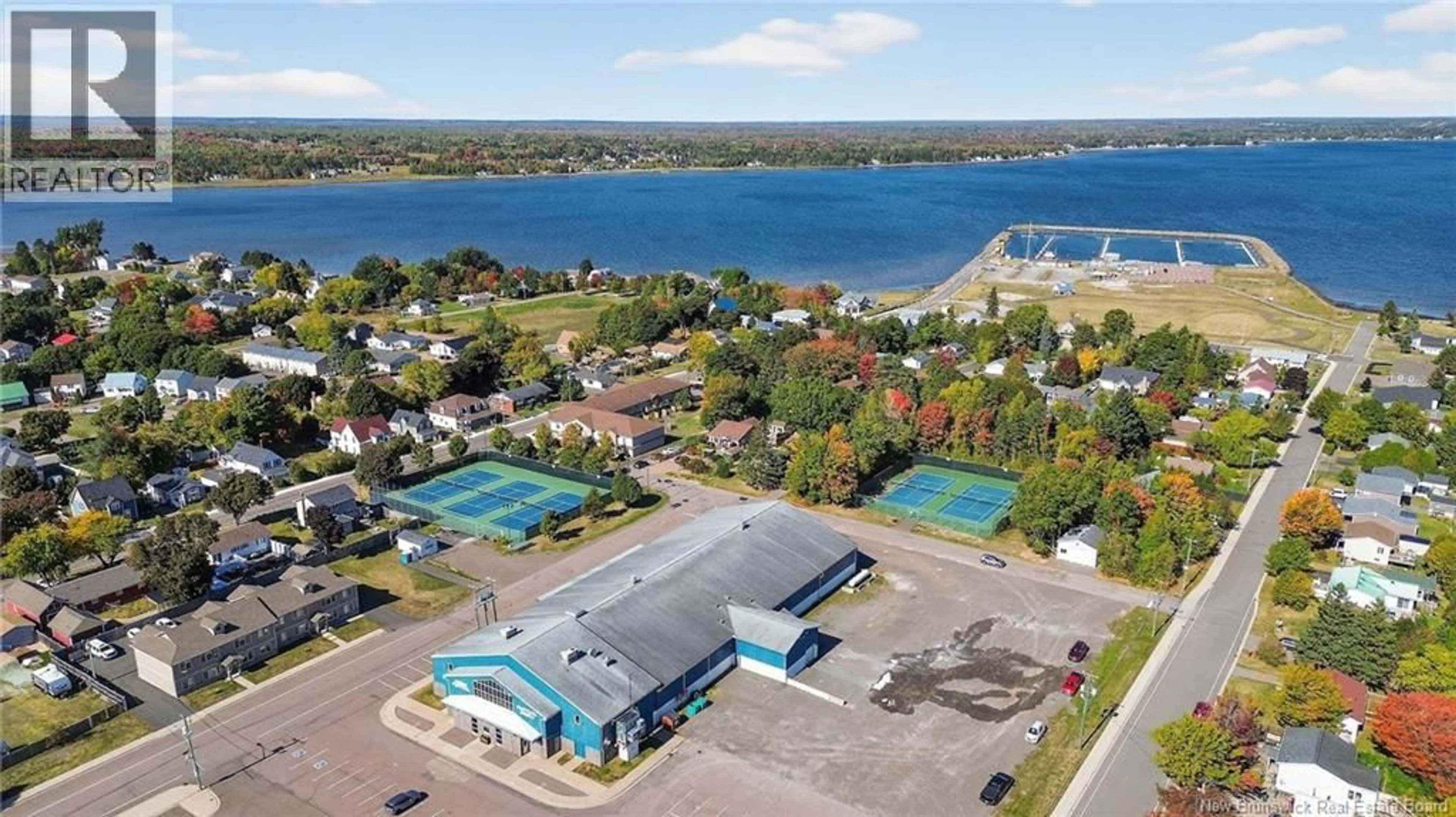 A pic from outside/outdoor area/front of a property/back of a property/a pic from drone, water/lake/river/ocean view for 201 - 98 PLEASANT STREET, Shediac New Brunswick E4P2L6