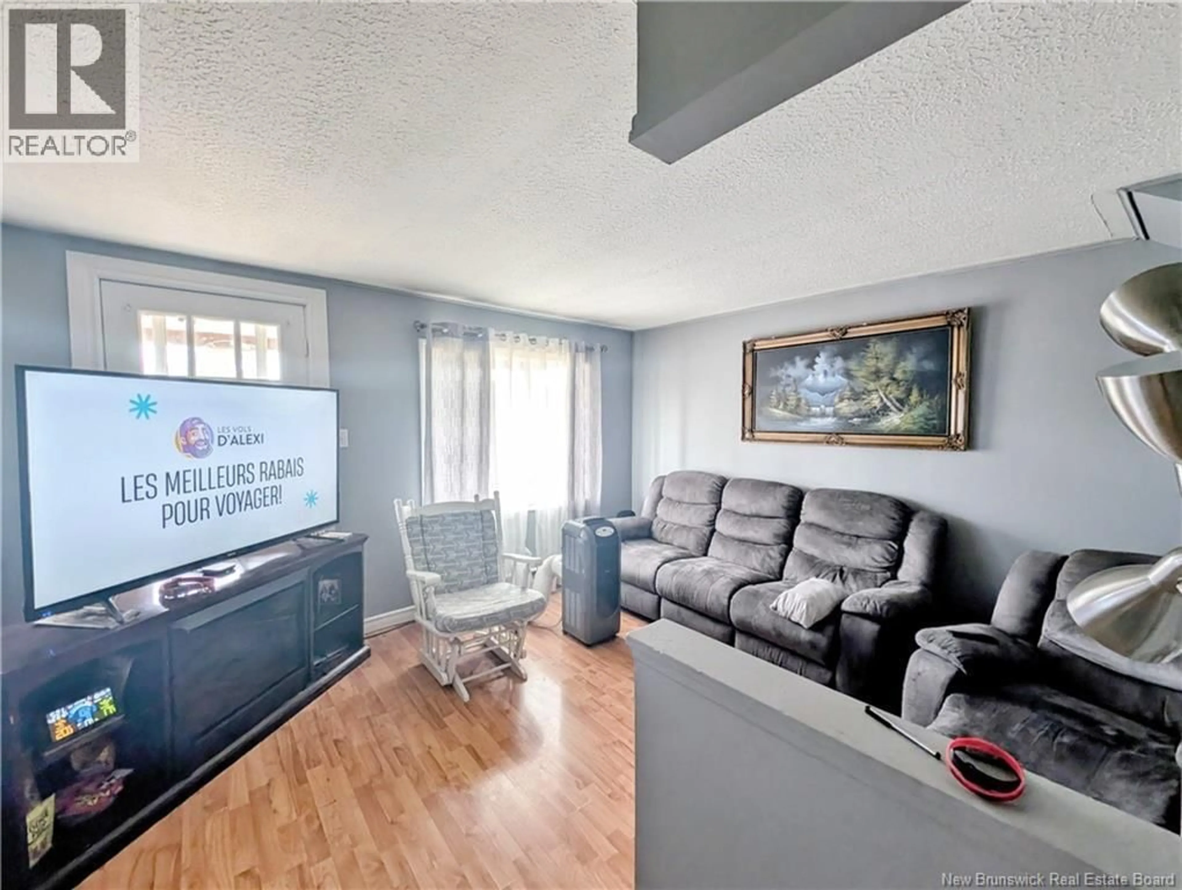 Living room with furniture, unknown for 328 BD DES ACADIENS, Bertrand New Brunswick E1W1C6