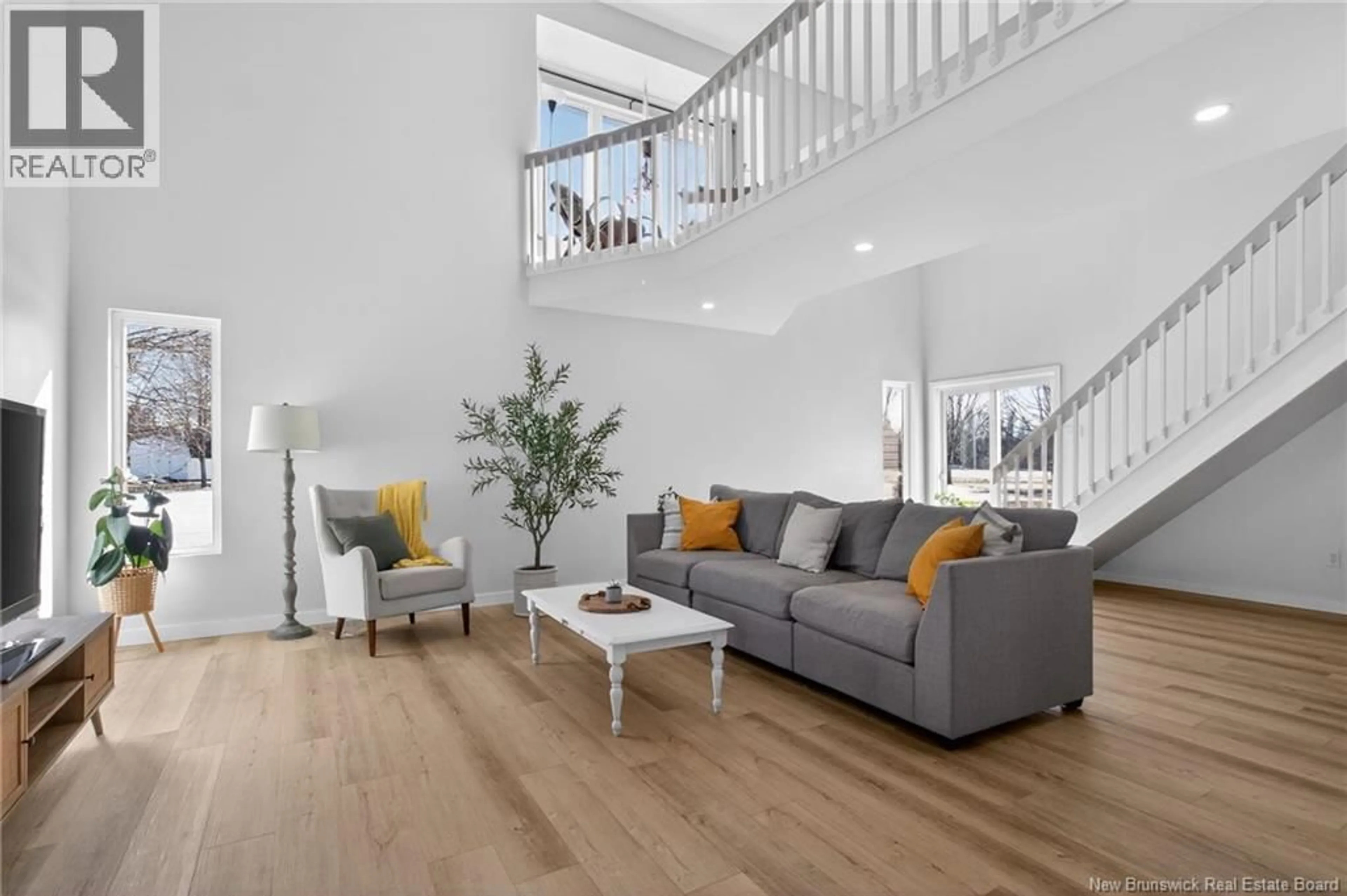 Living room with furniture, wood/laminate floor for 28 CHEMIN DE LA BRÈCHE, Grand-Barachois New Brunswick E4P7B8