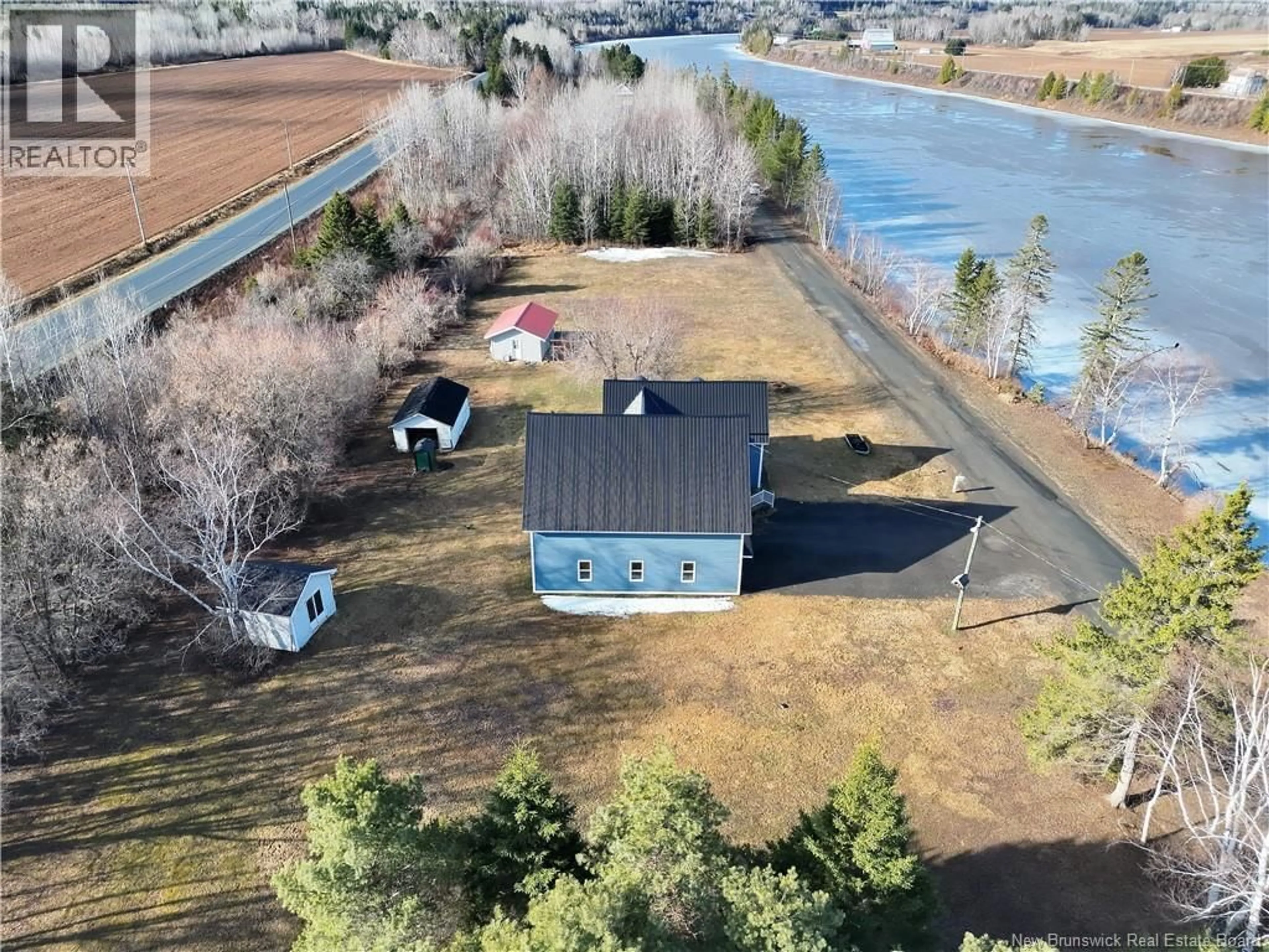 A pic from outside/outdoor area/front of a property/back of a property/a pic from drone, water/lake/river/ocean view for 36 OLD RIVER ROAD, Red Rapids New Brunswick E7H3H2