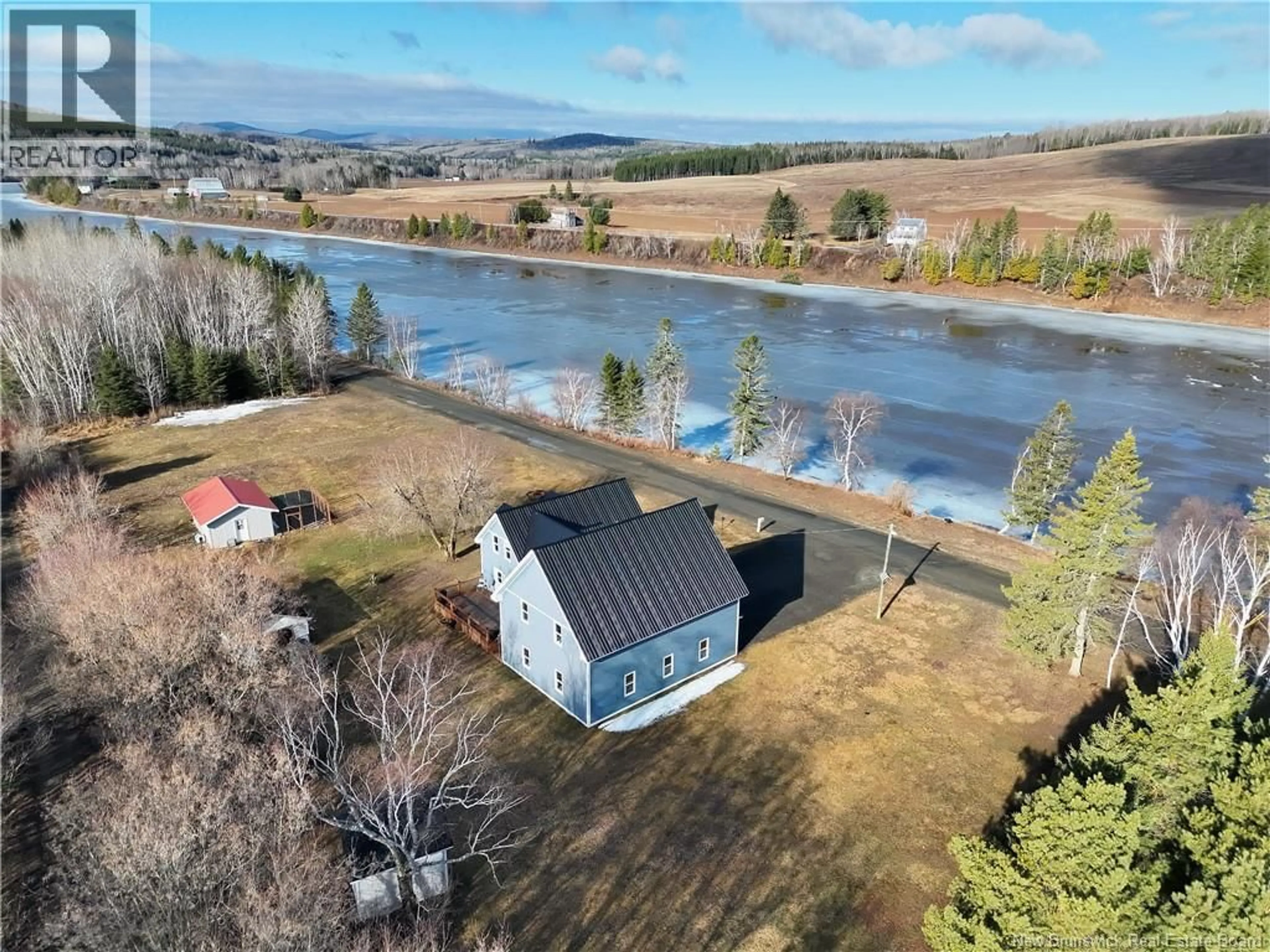 A pic from outside/outdoor area/front of a property/back of a property/a pic from drone, water/lake/river/ocean view for 36 OLD RIVER ROAD, Red Rapids New Brunswick E7H3H2