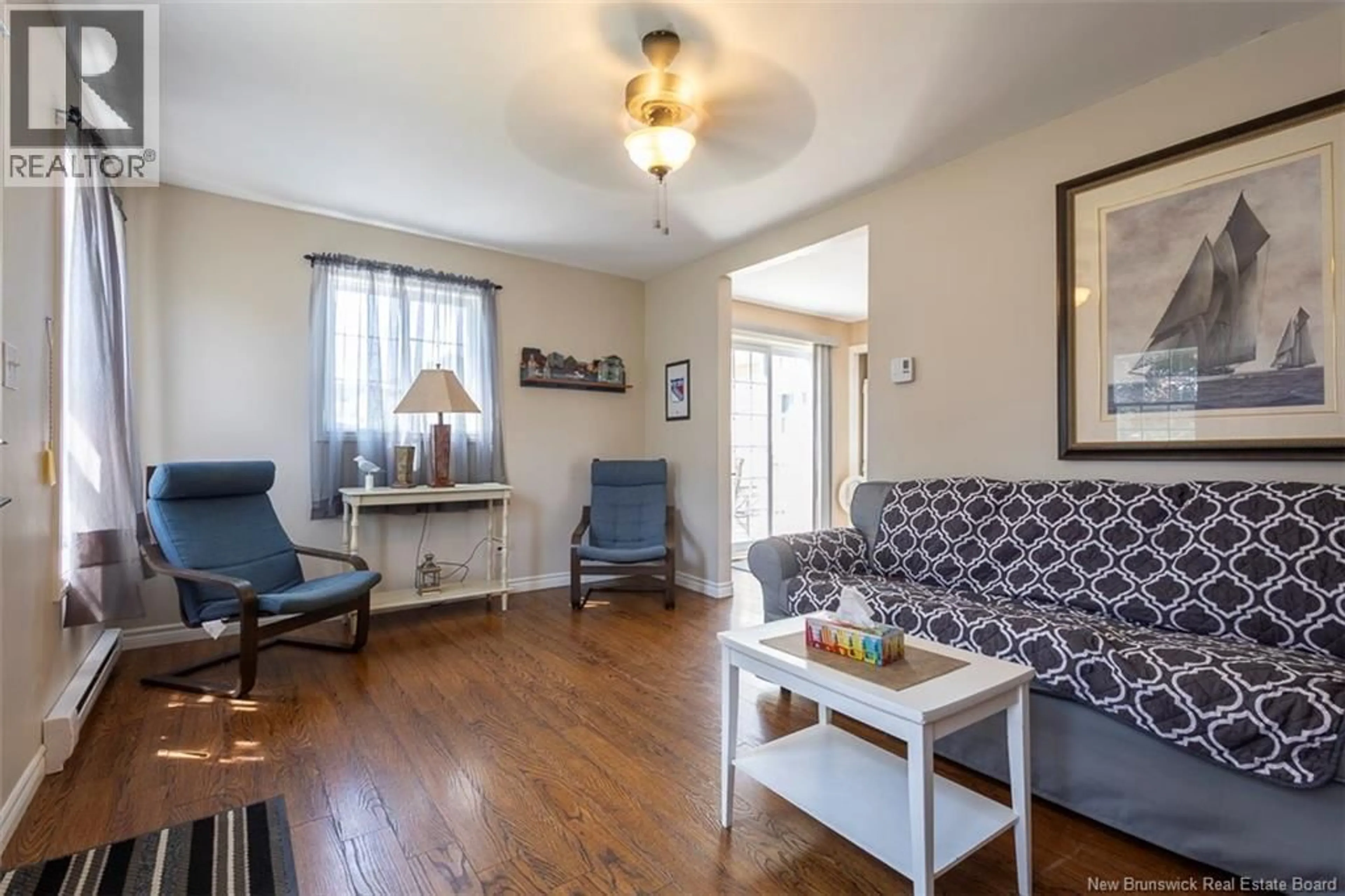 Living room with furniture, wood/laminate floor for 7 JARVIS STREET, Pointe-Du-Chêne New Brunswick E4P4M6