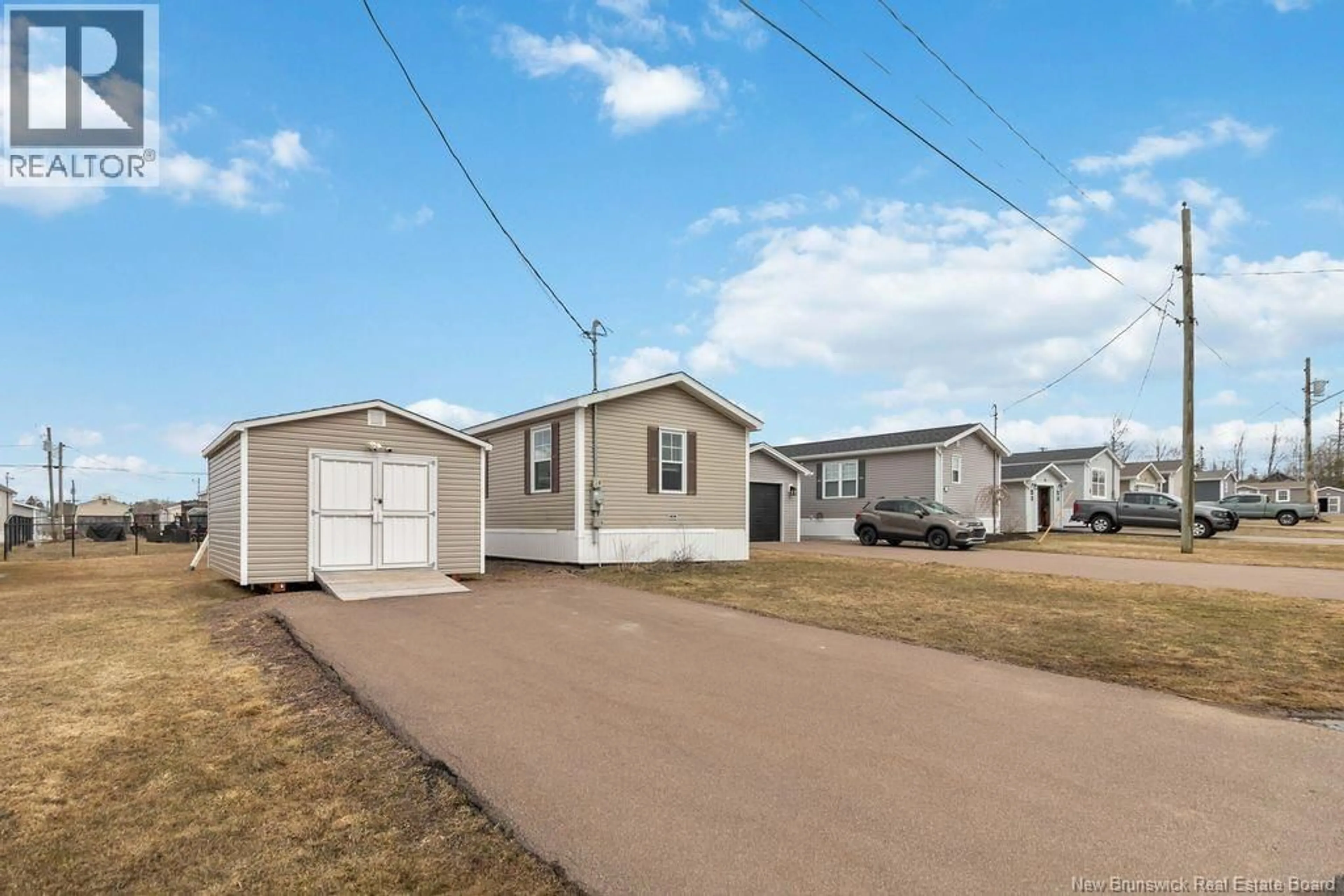 Home with vinyl exterior material, street for 28 GASPEREAU LANE, Dieppe New Brunswick E1A9S3