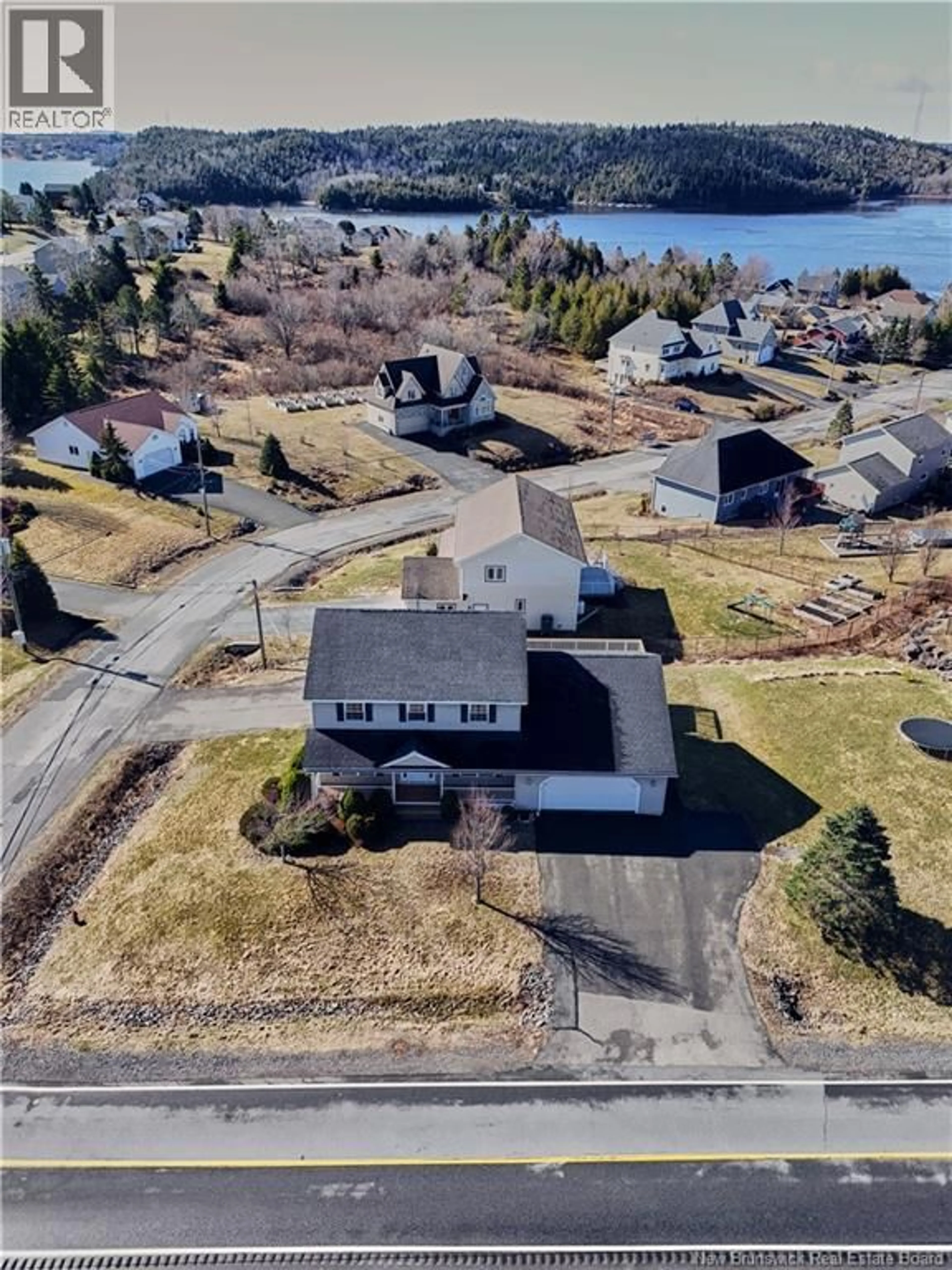 A pic from outside/outdoor area/front of a property/back of a property/a pic from drone, water/lake/river/ocean view for 77 CEDARWOOD DRIVE, Saint John New Brunswick E2K5P5