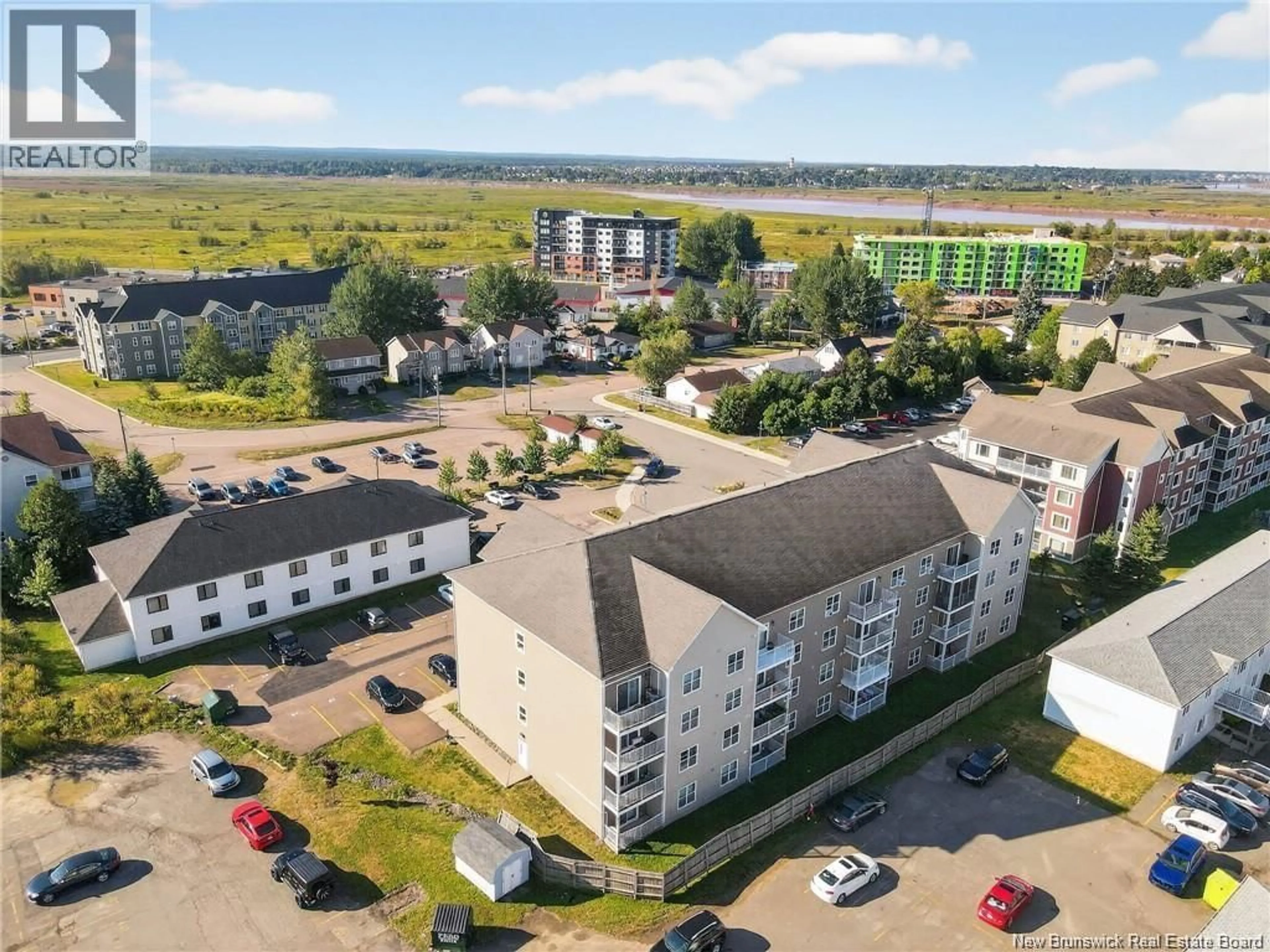 A pic from outside/outdoor area/front of a property/back of a property/a pic from drone, unknown for 407 - 33 SIFROI STREET, Dieppe New Brunswick E1A5T1