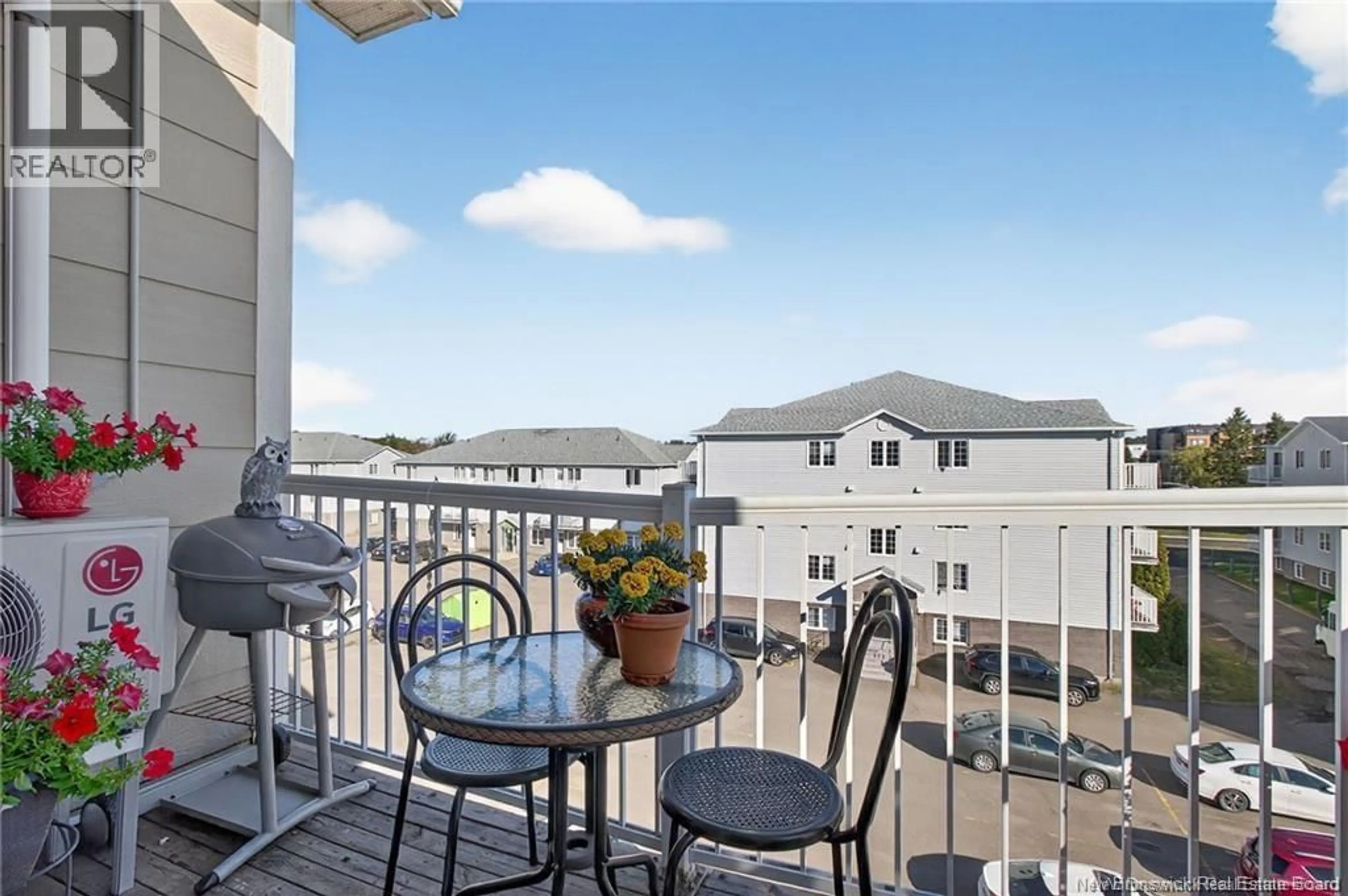 Patio, city buildings view from balcony for 407 - 33 SIFROI STREET, Dieppe New Brunswick E1A5T1