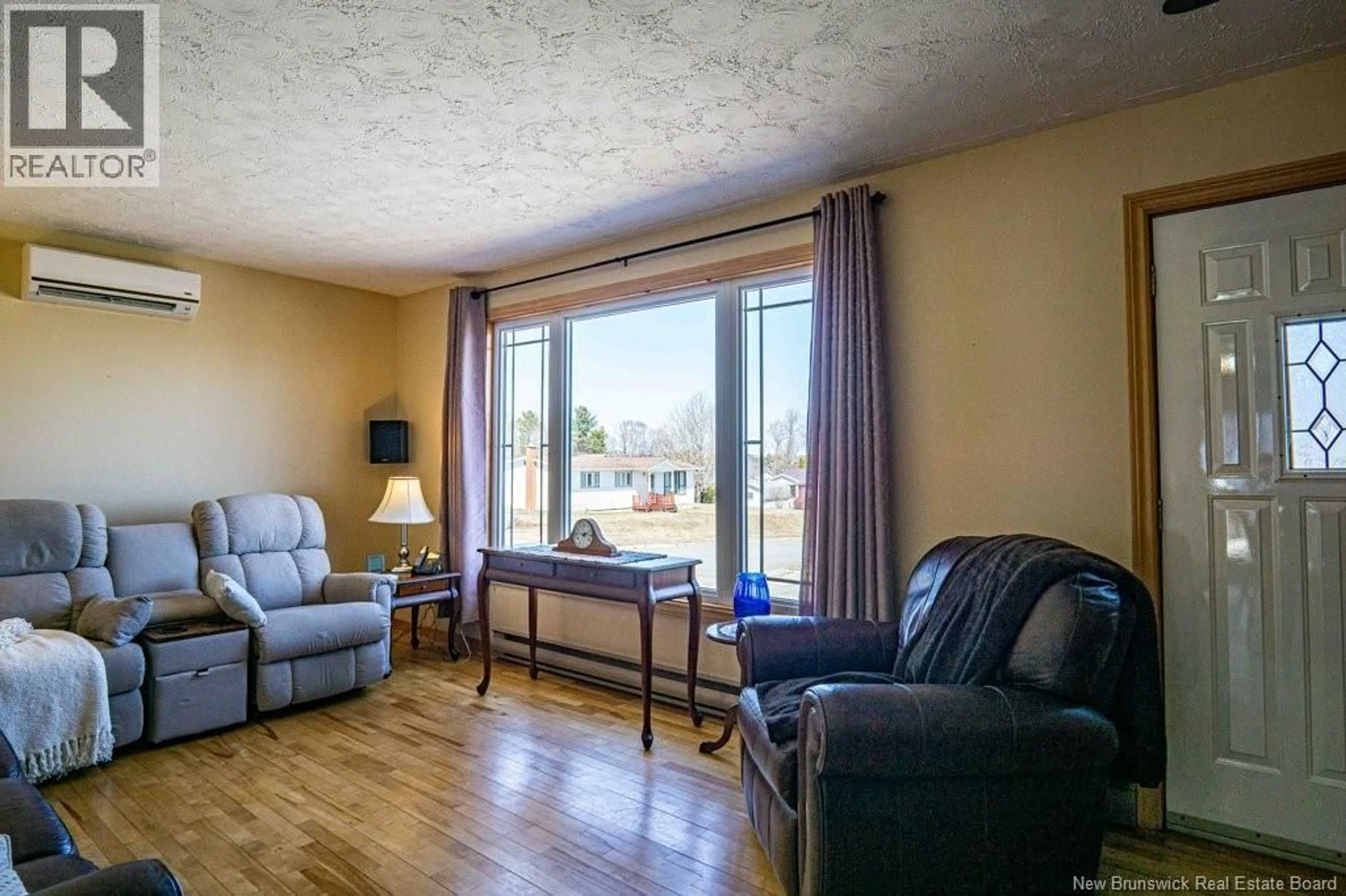 Living room with furniture, wood/laminate floor for 16 HARDING DRIVE, Nackawic New Brunswick E6G1C4