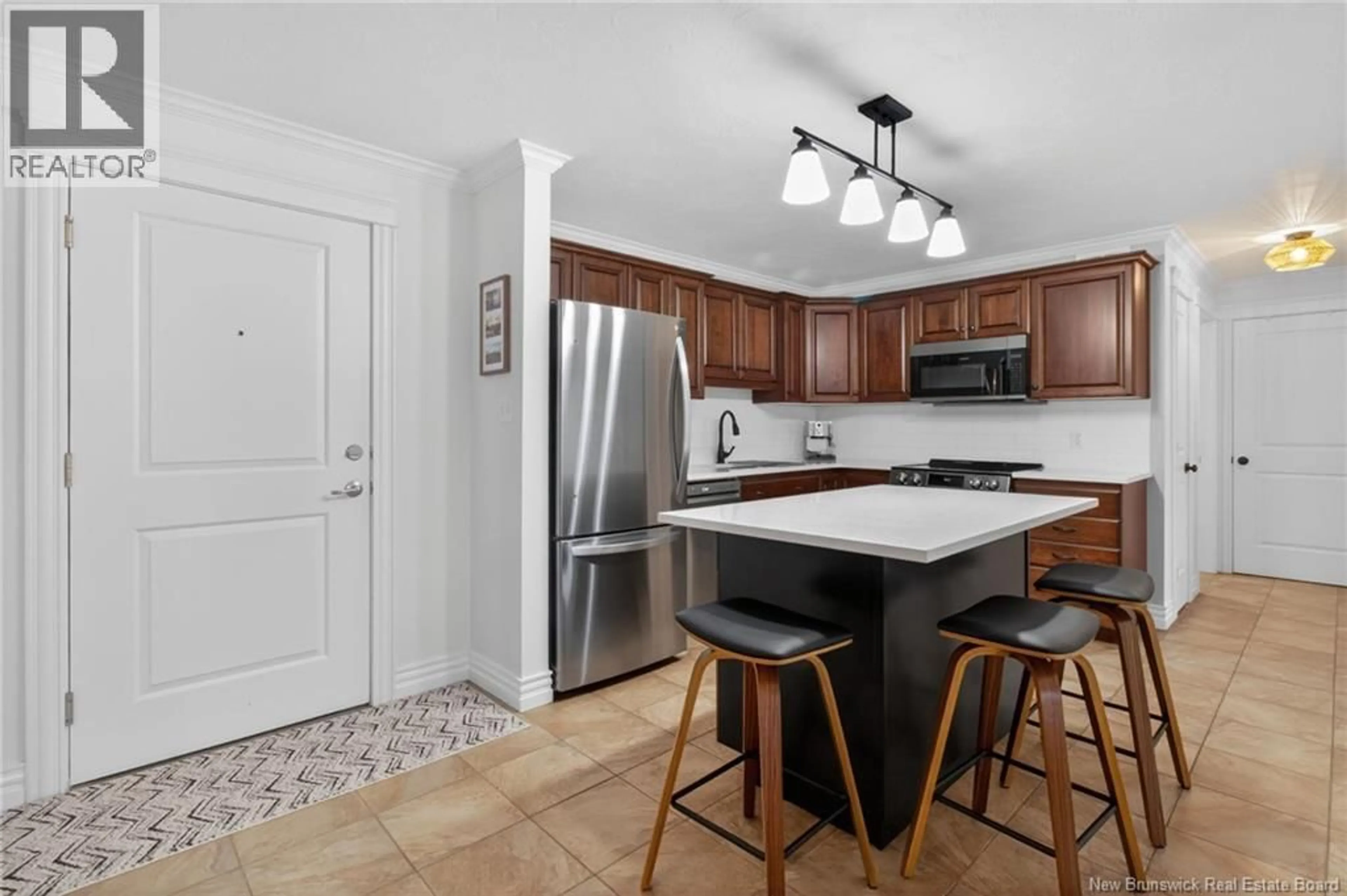 Open concept kitchen, ceramic/tile floor for 402 - 65 DIAMOND HEAD COURT, Moncton New Brunswick E1G0V6