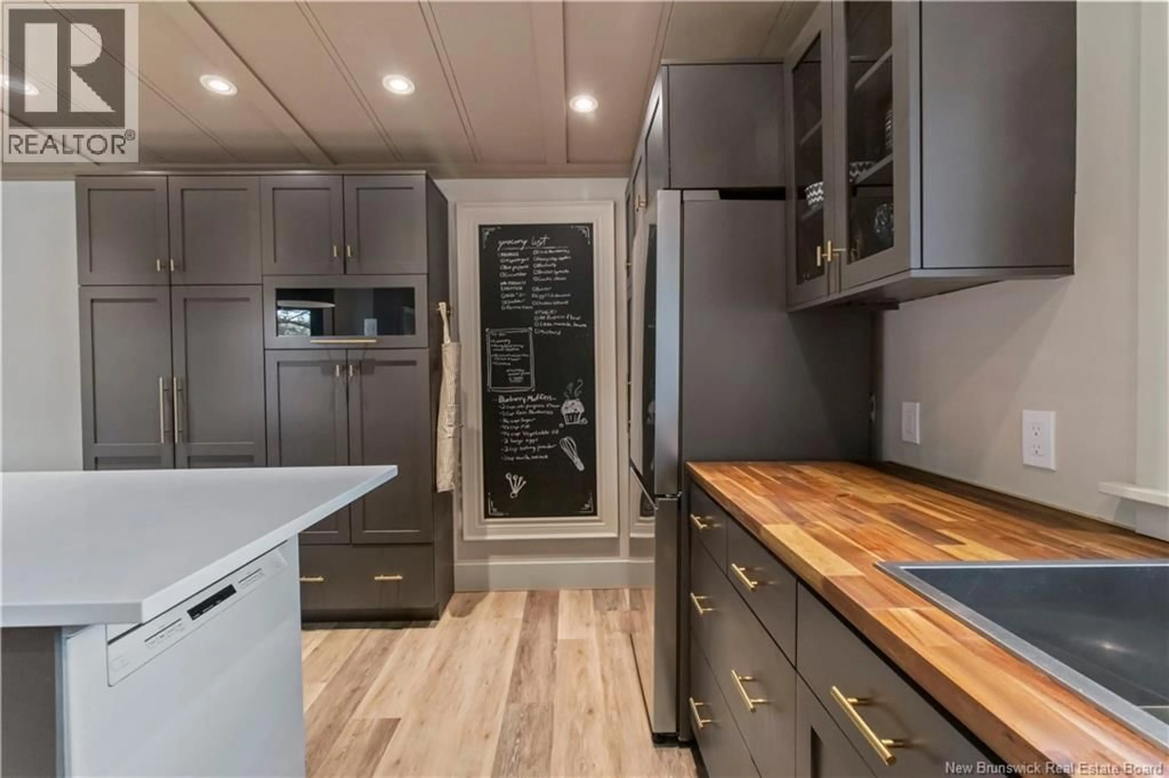 Open concept kitchen, wood/laminate floor for 8 RAWORTH AVENUE, Lakeville New Brunswick E1H1J4